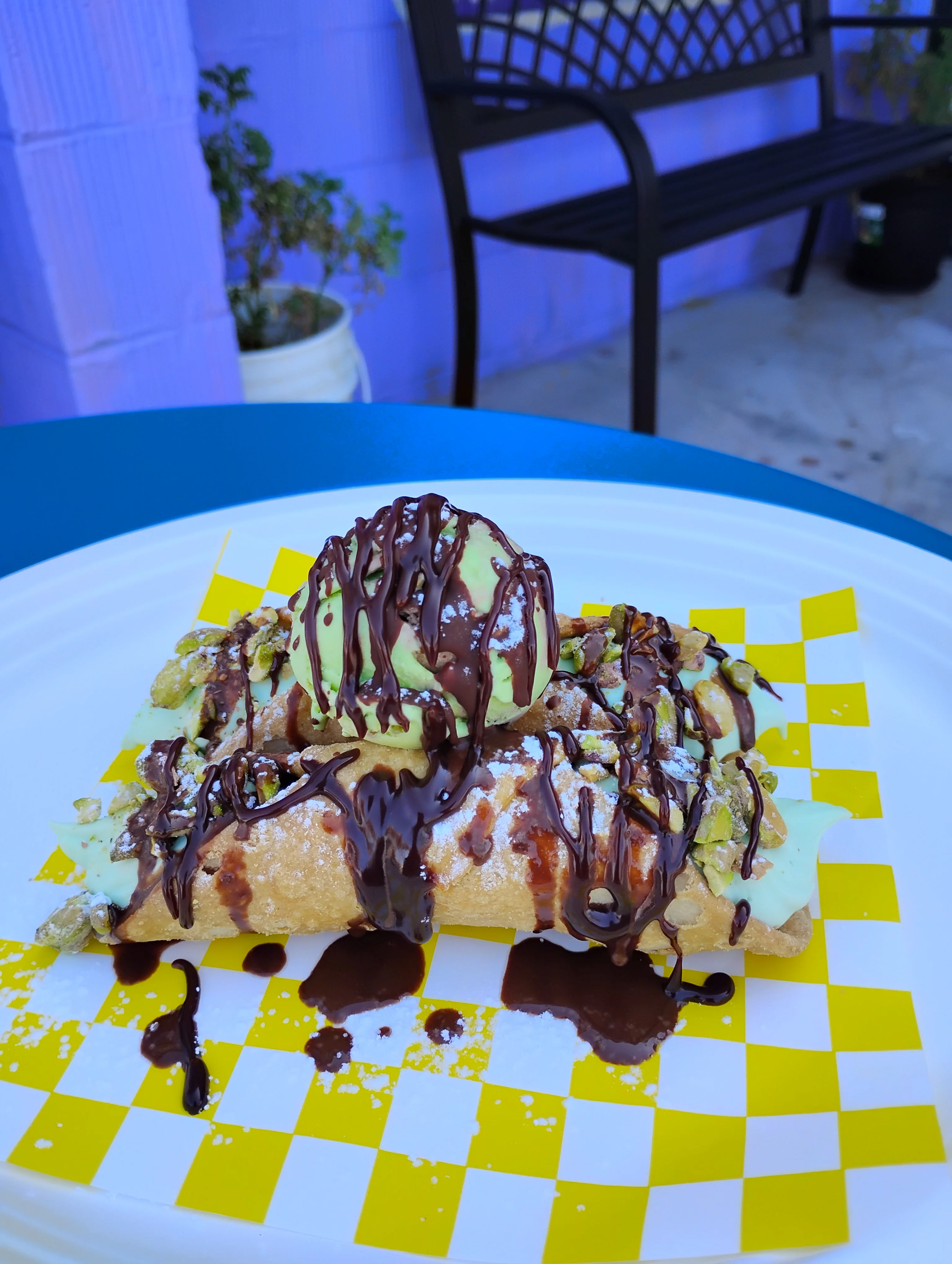 Delicious dessert nachos topped with ice cream and chocolate drizzle