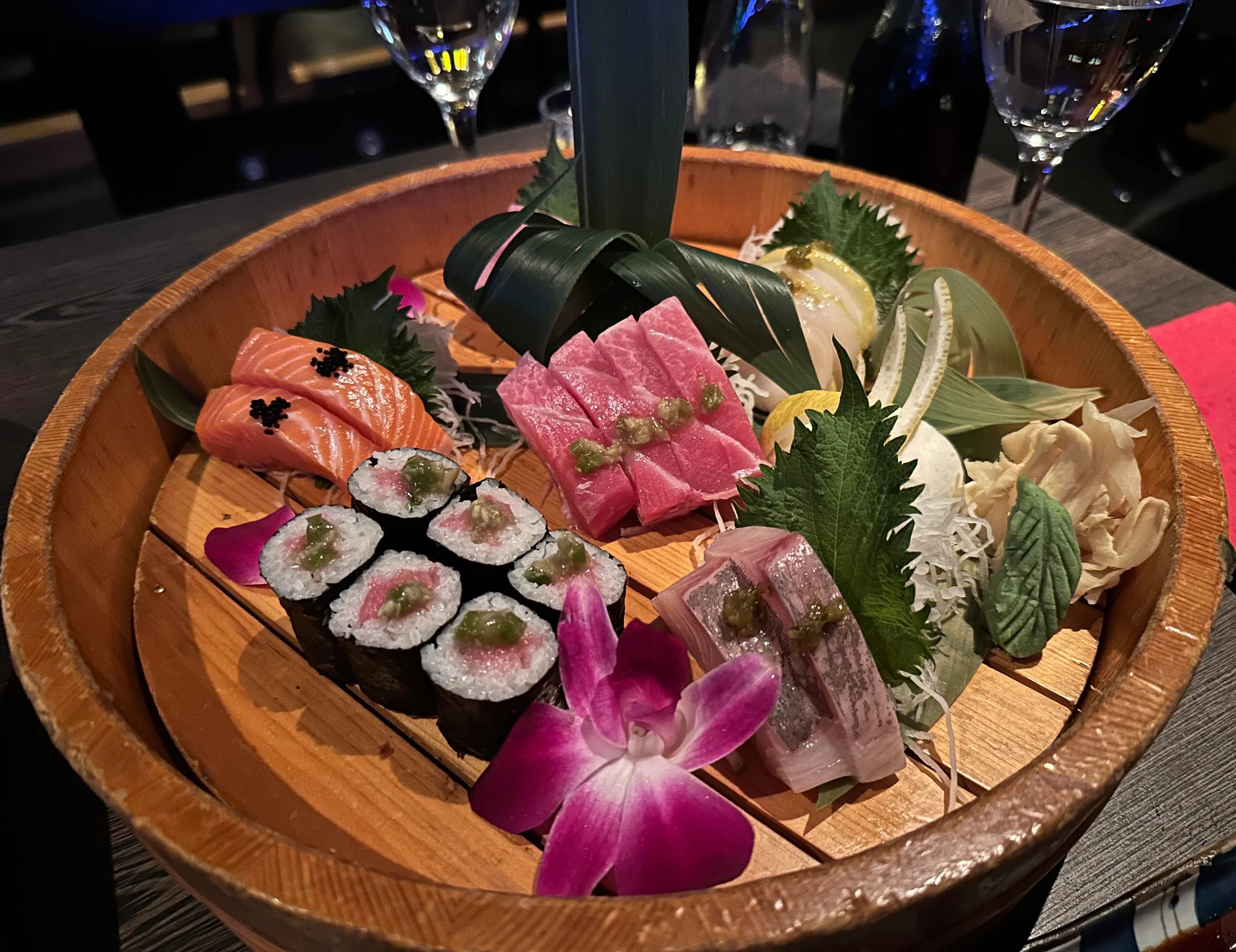 Assorted sushi platter featuring sashimi and rolls