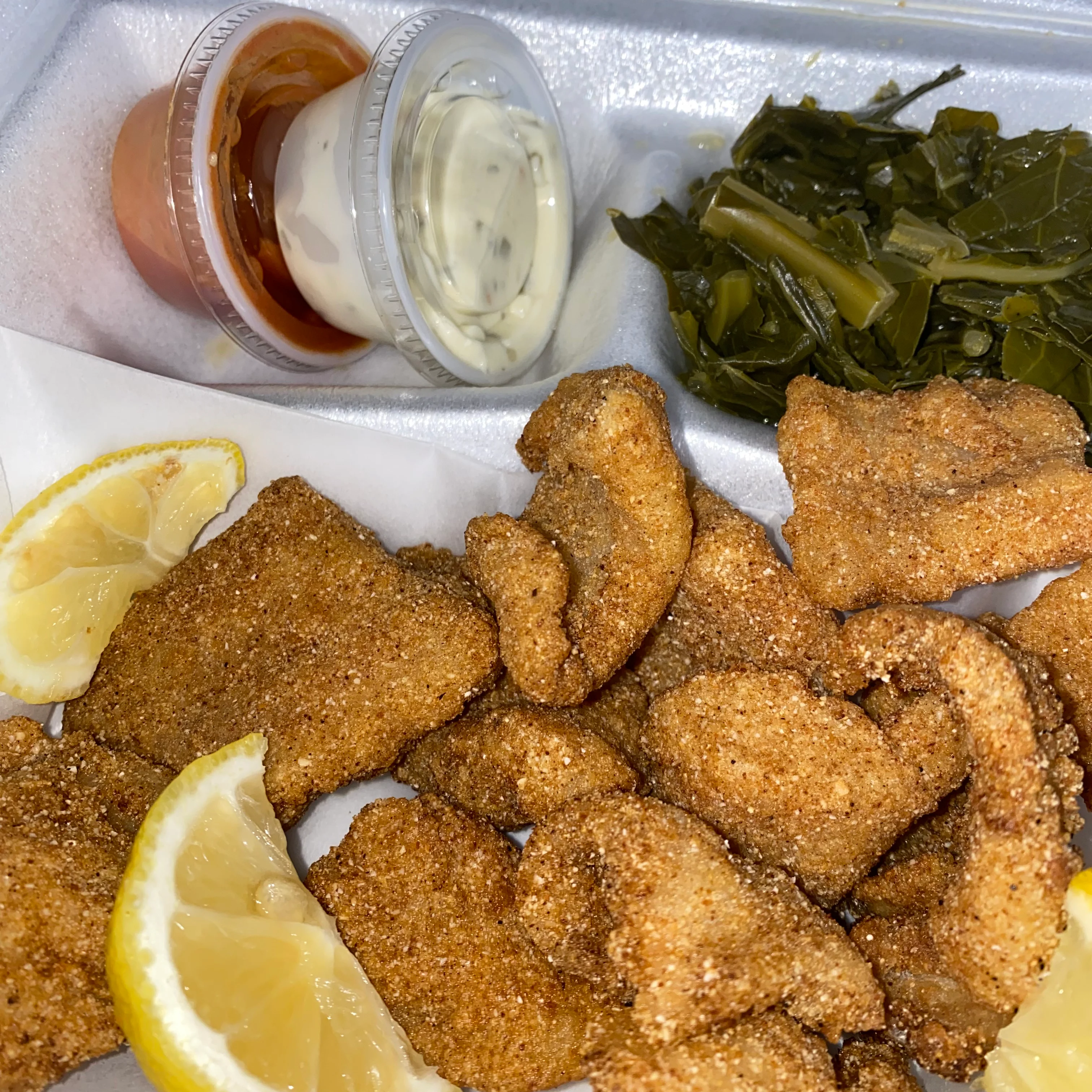 Southern fried catfish with lemon and sides