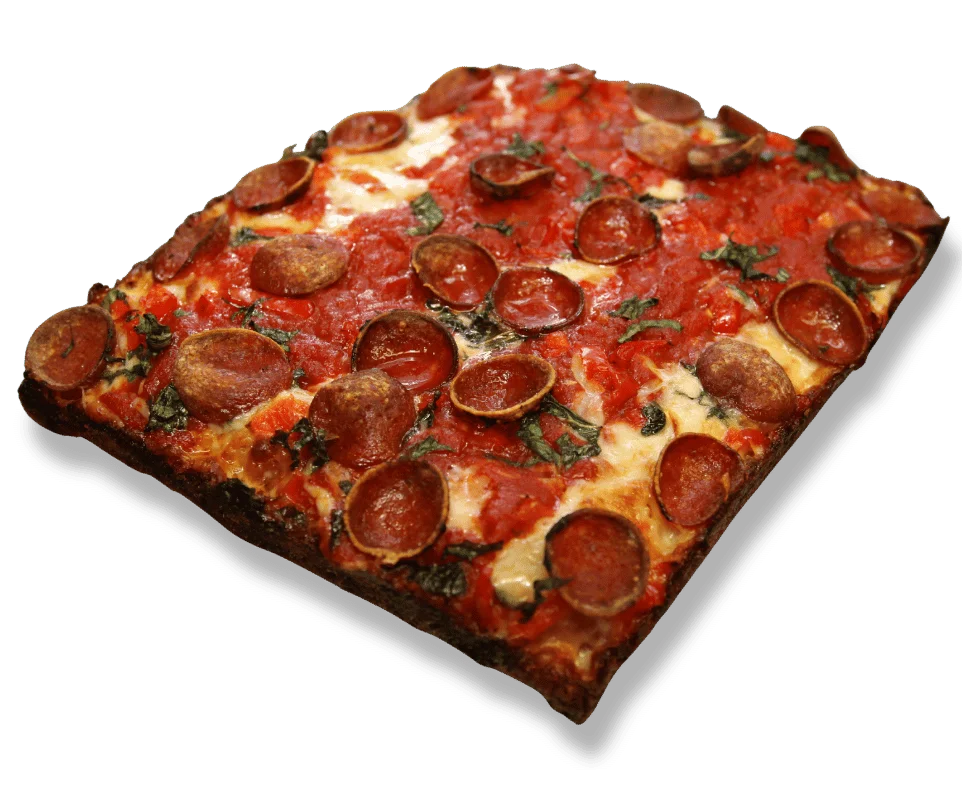 Detroit-style pizza with a crispy crust and toppings.