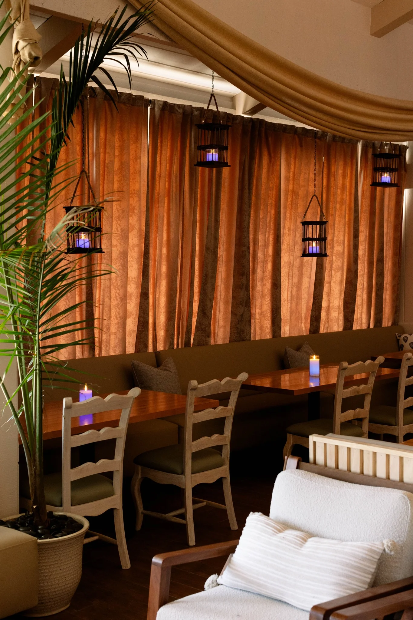 Cozy restaurant interior with warm curtains and ambient lighting