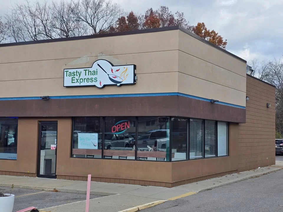 Exterior view of Tasty Thai Express restaurant with open sign