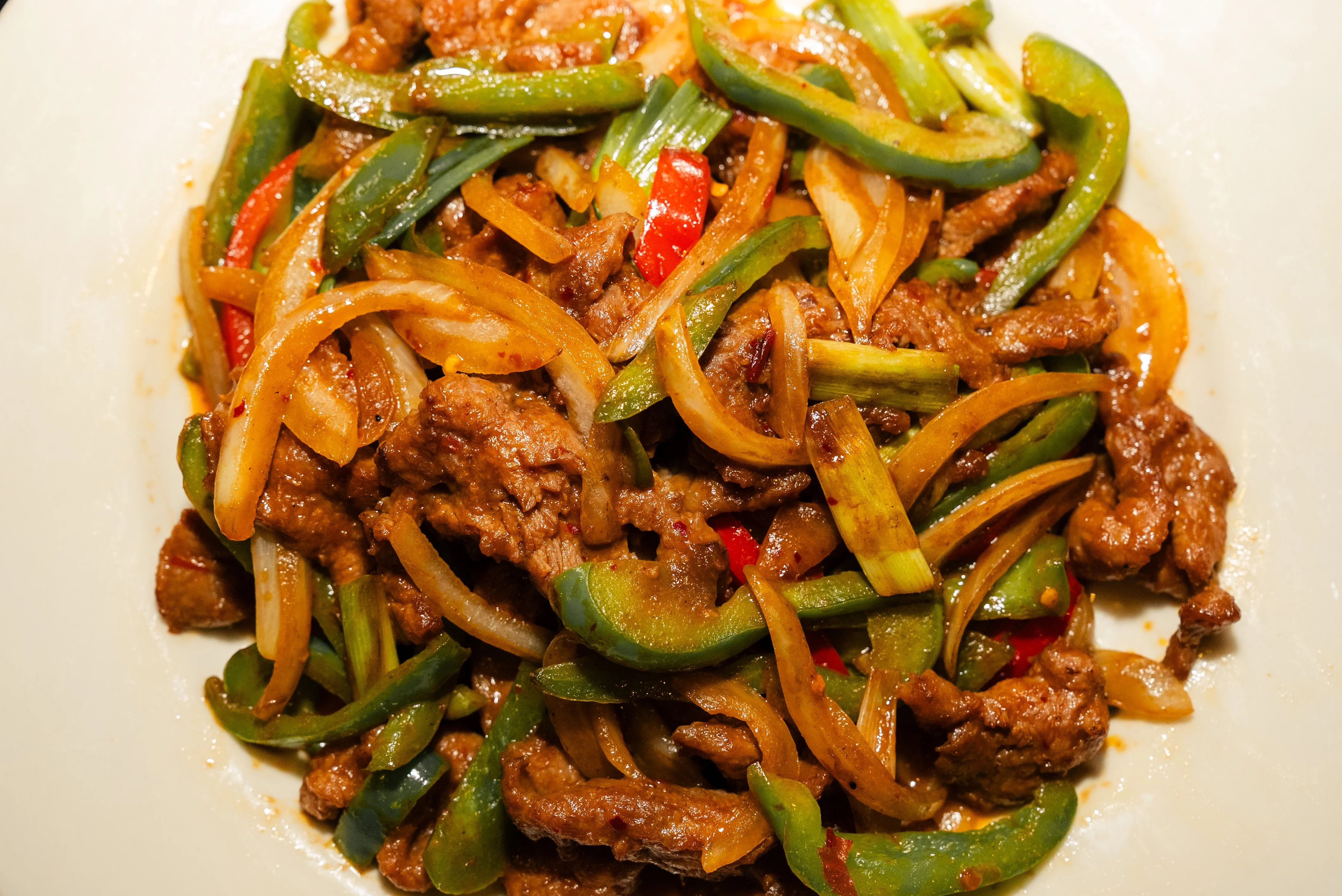 Sizzling beef stir-fry with bell peppers and onions
