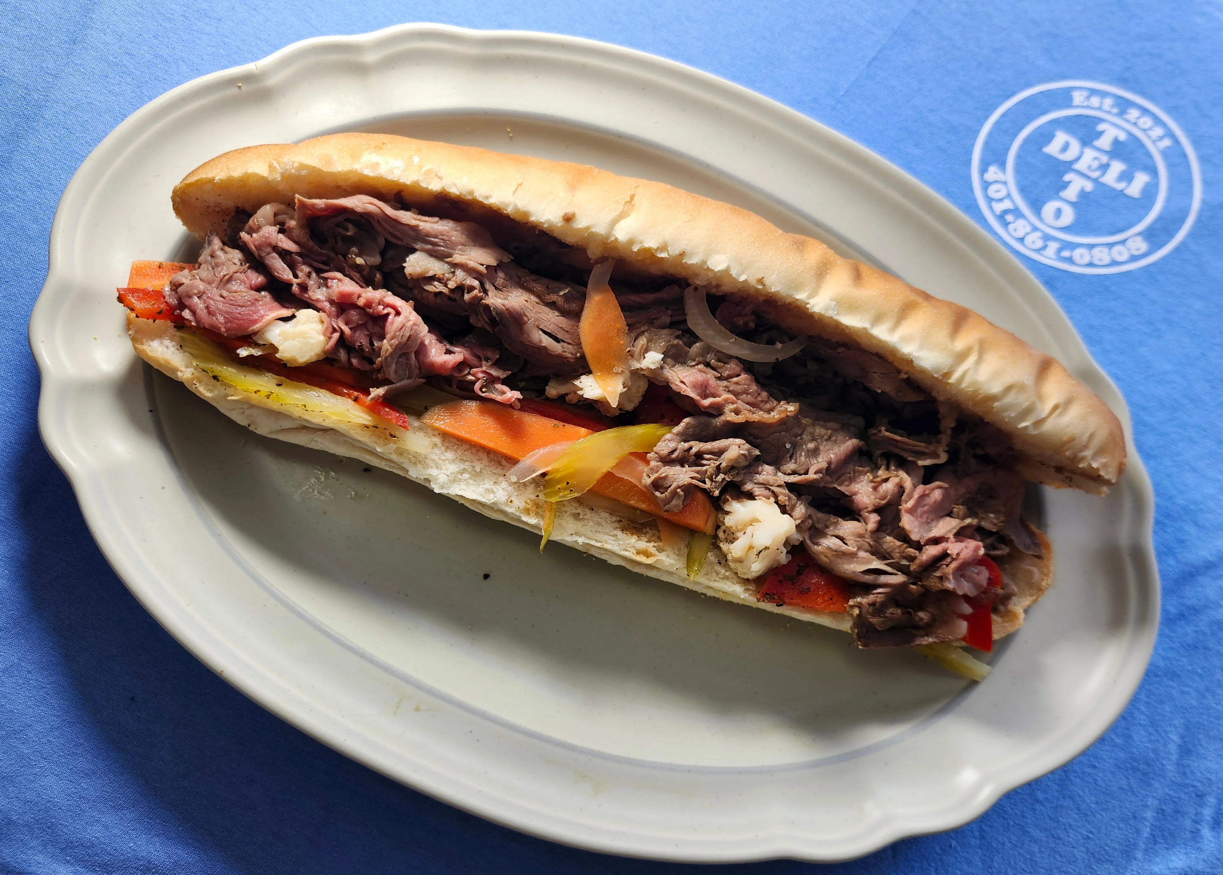Italian beef sandwich with peppers on a plate