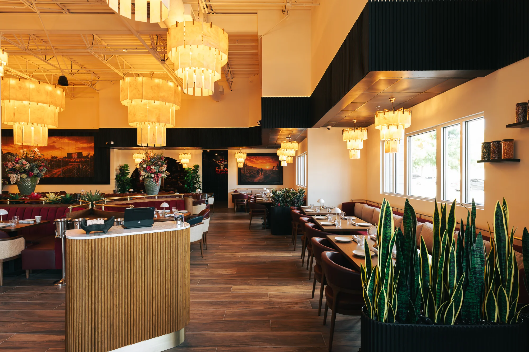 Elegant restaurant interior with modern chandeliers and stylish seating