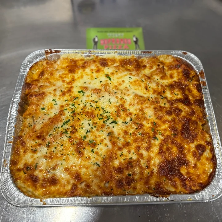 A baked dish with a golden, cheesy top, garnished with herbs.