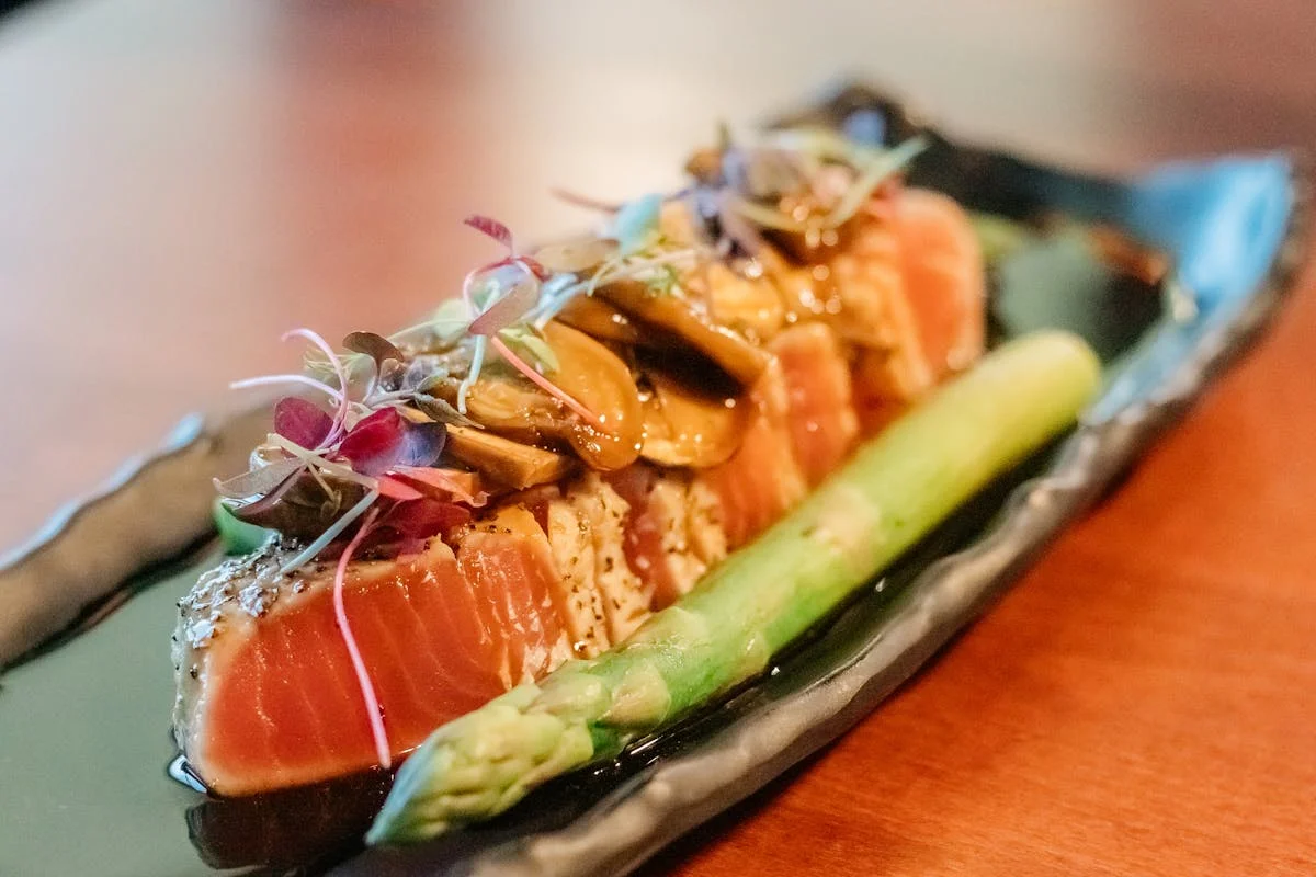Japanese sushi platter with seared salmon and asparagus