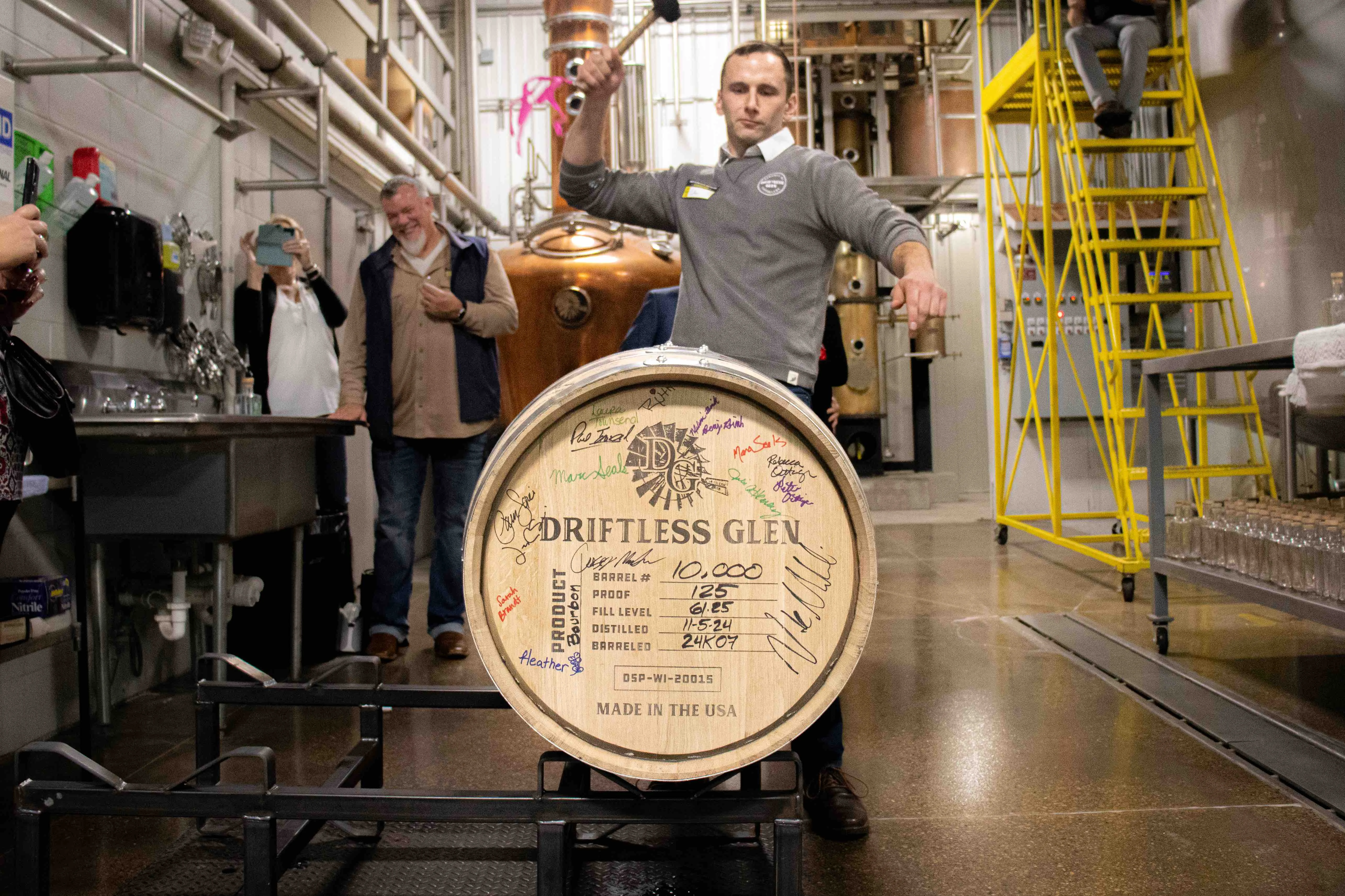 Distiller Nate seals barrel 10,000 during the dinner party to celebrate 10,000 barrels