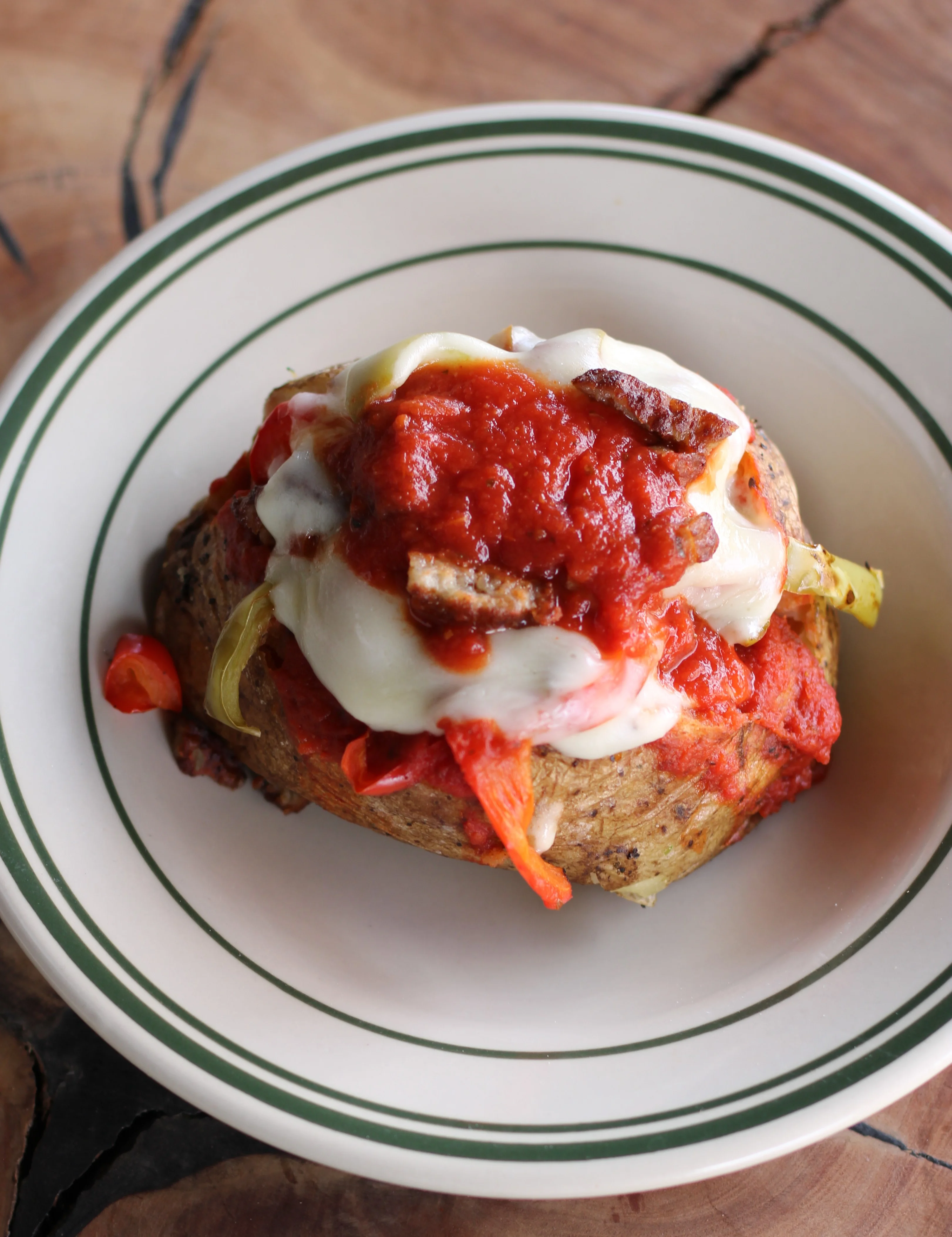Italian stuffed baked potato with marinara and melted cheese