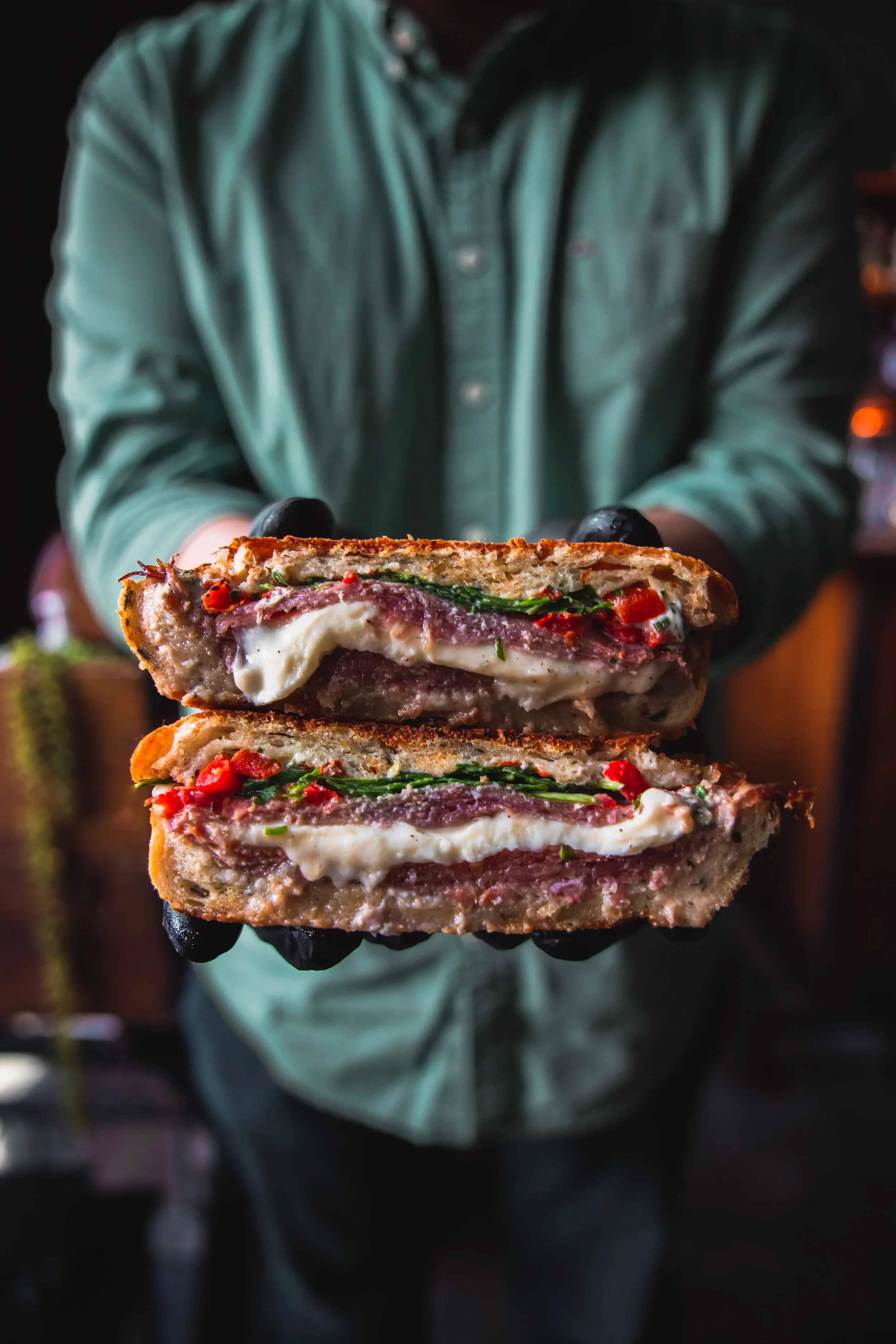 Italian panini sandwich with layers of meat and cheese