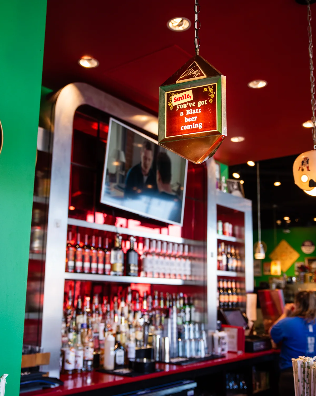 Vibrant bar interior with a sign promoting Blatz beer