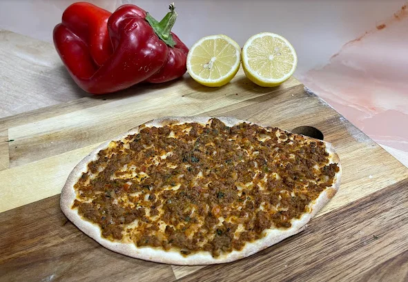Turkish lahmacun topped with spiced meat