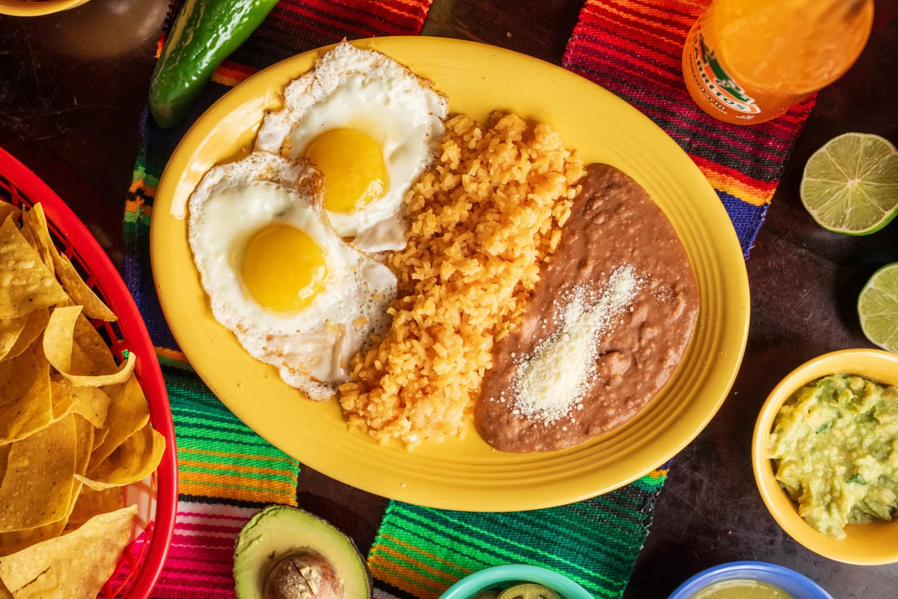 refried beans, mexican rice, half fried eggs