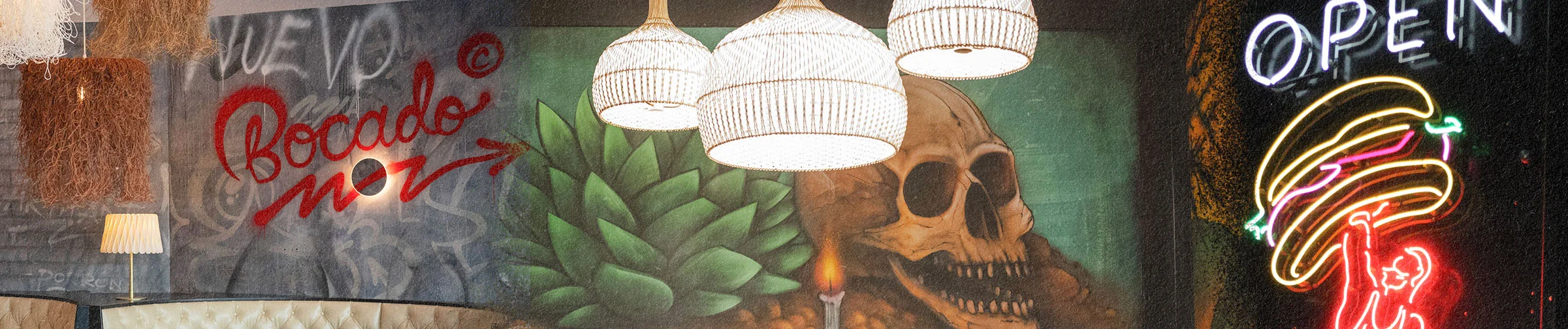 Vibrant restaurant interior with artistic murals and unique lighting