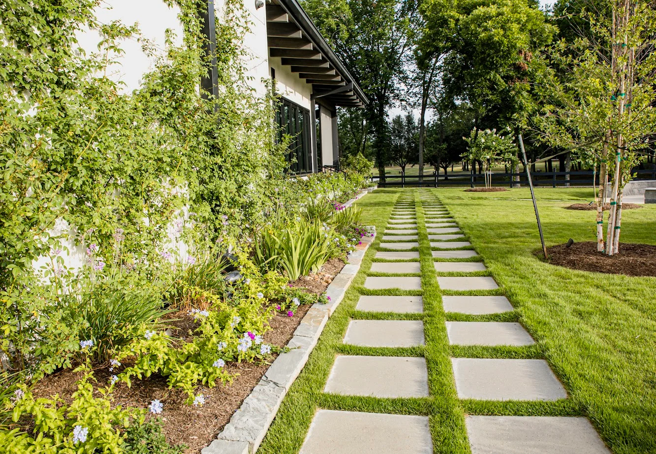 Beautiful garden pathway with stone pavers and lush greenery