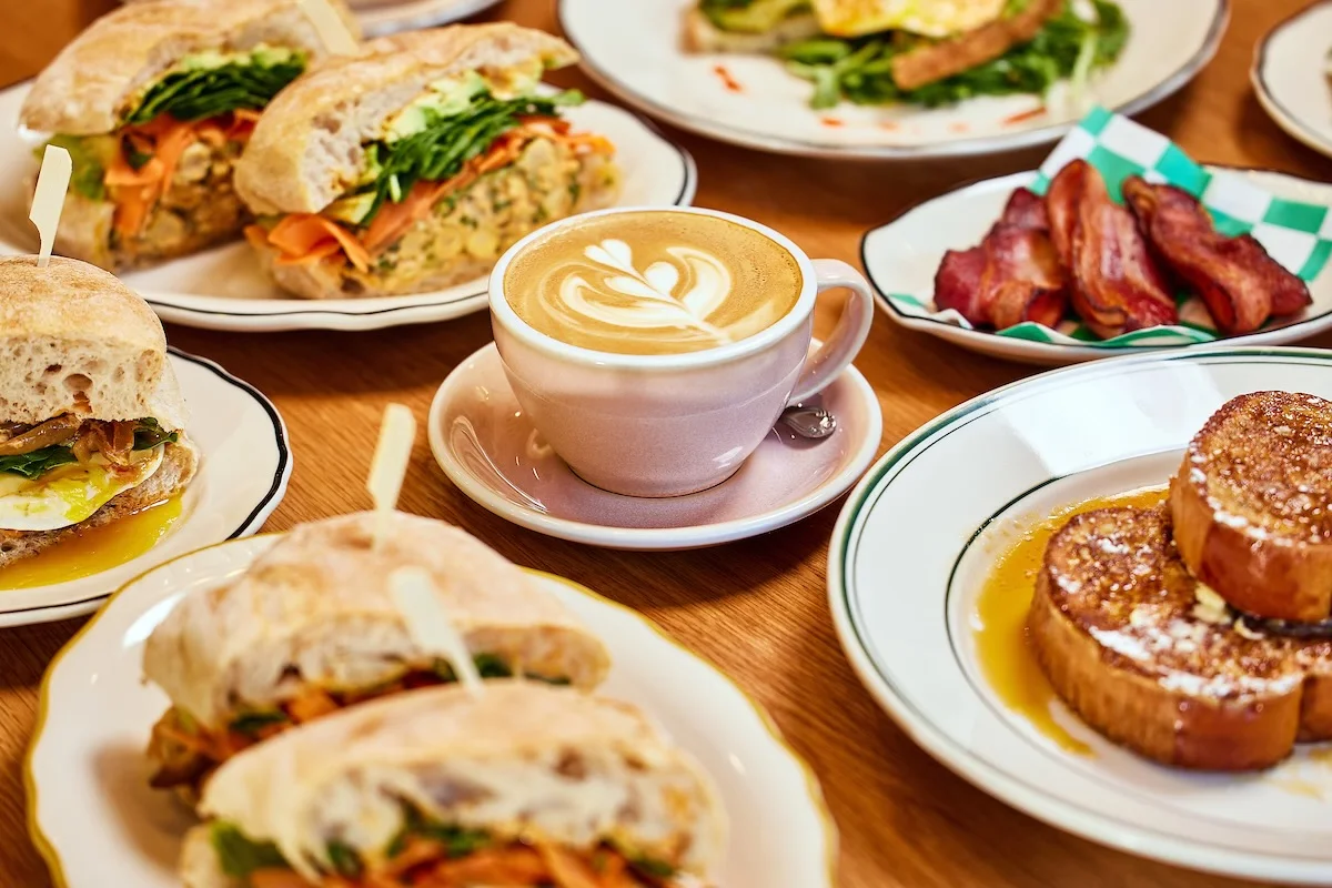 Artisan breakfast sandwiches and latte in a cozy café setting