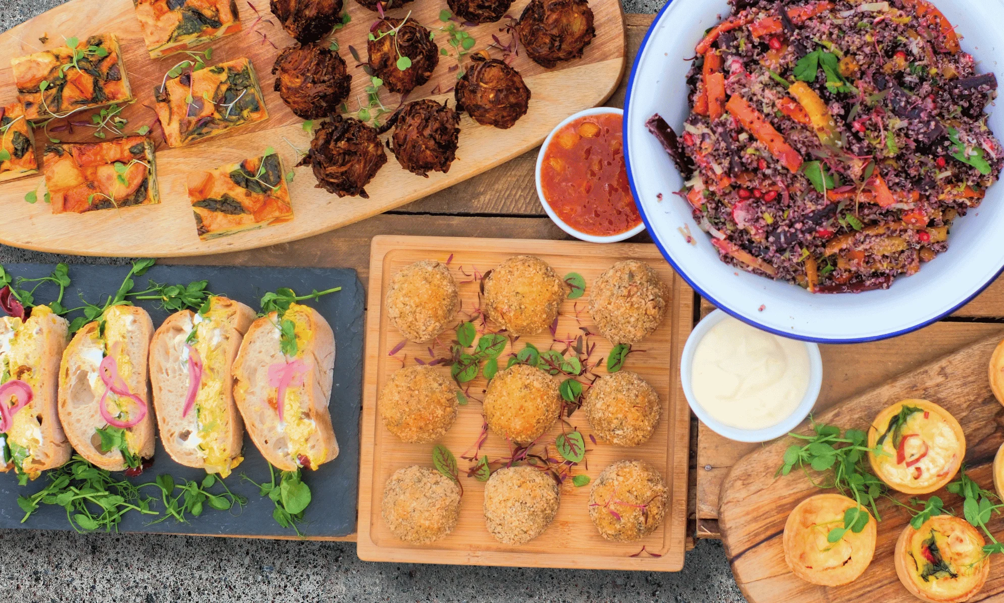 Assorted Mediterranean mezze platter with fresh salads and wraps