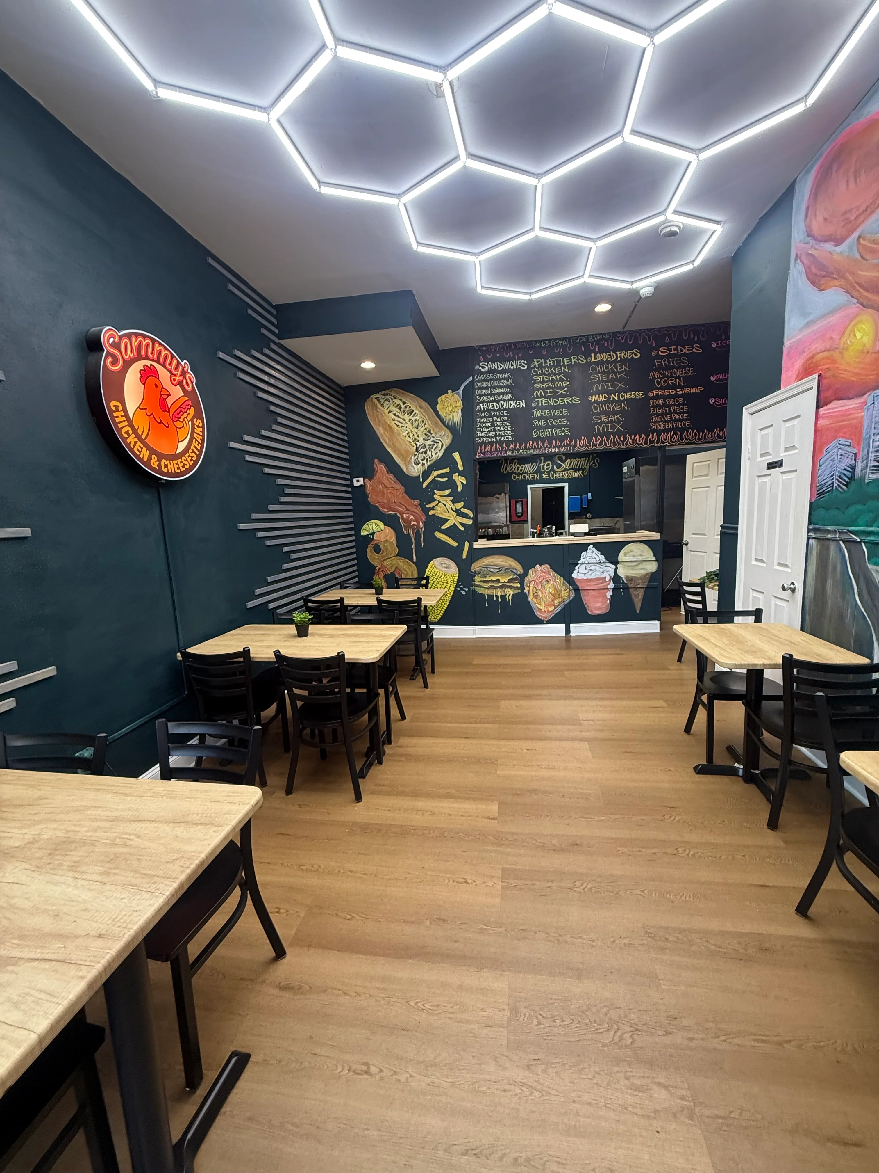 Cozy restaurant interior with vibrant murals and modern lighting