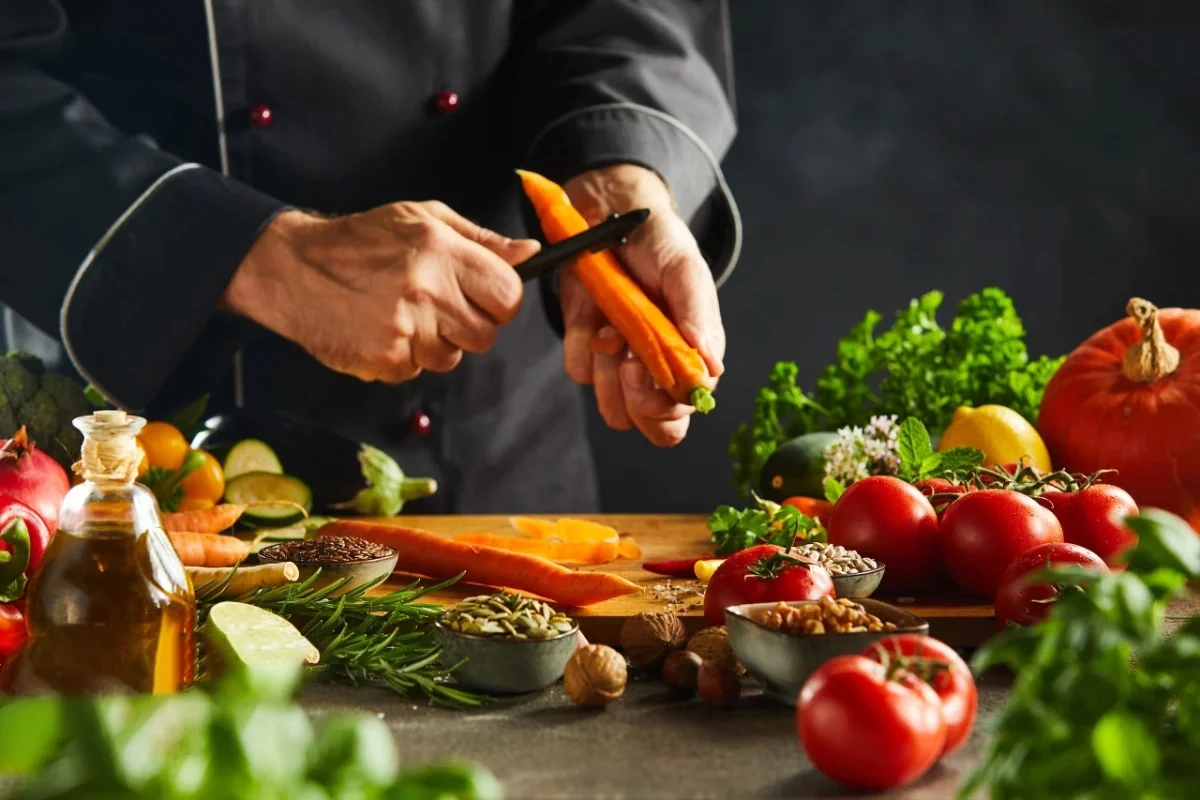 Chef preparing fresh vegetables for a Mediterranean dish