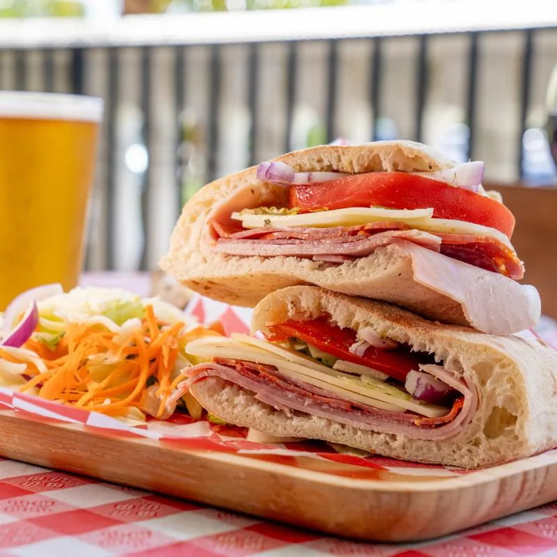Italian sub sandwich with layers of meats and fresh vegetables
