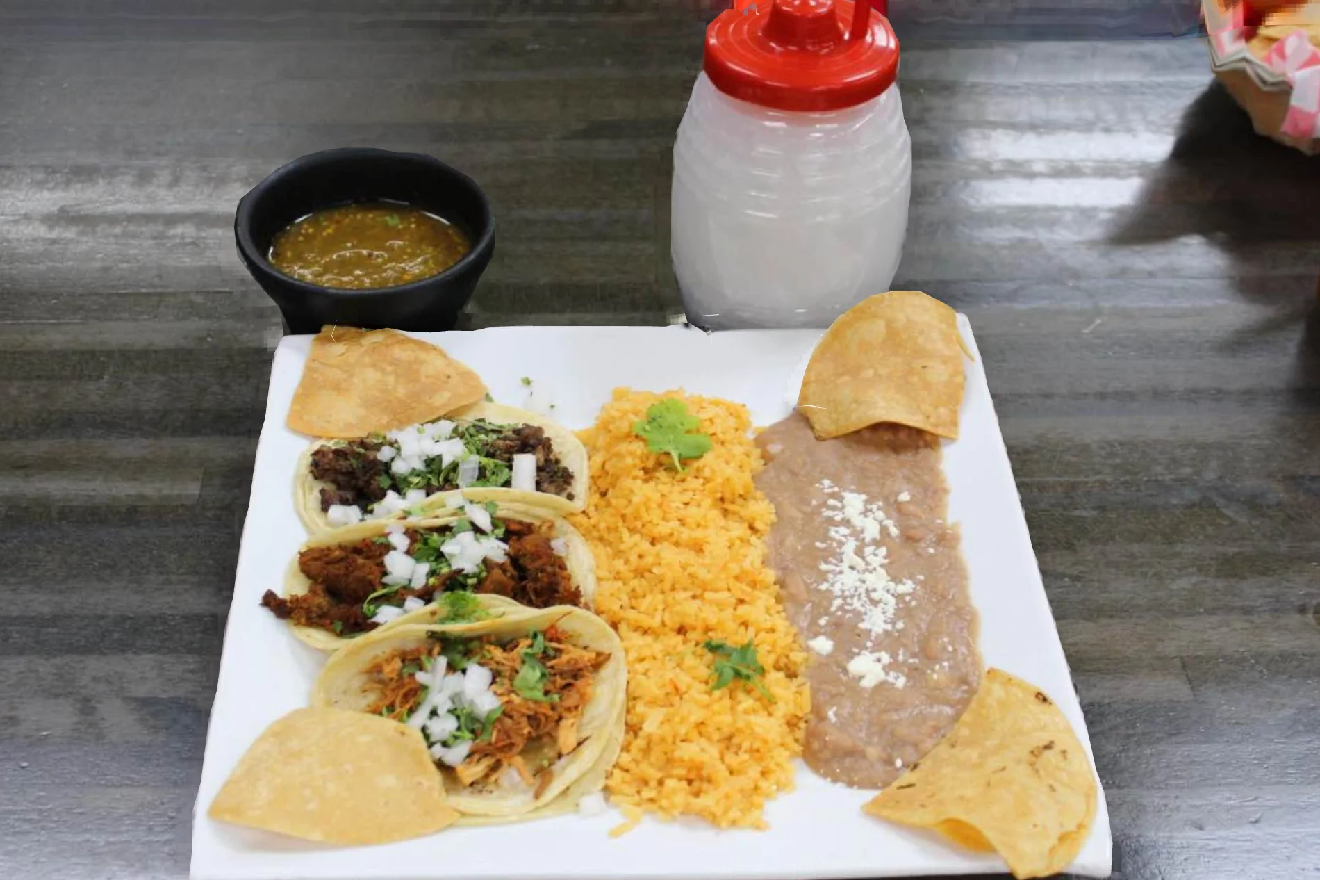 Authentic Mexican tacos with rice and beans