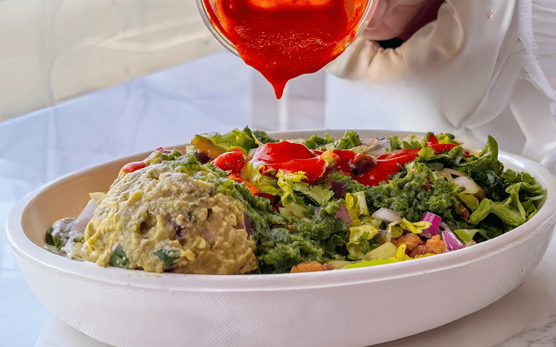 Vibrant Mexican salad with guacamole and spicy sauce