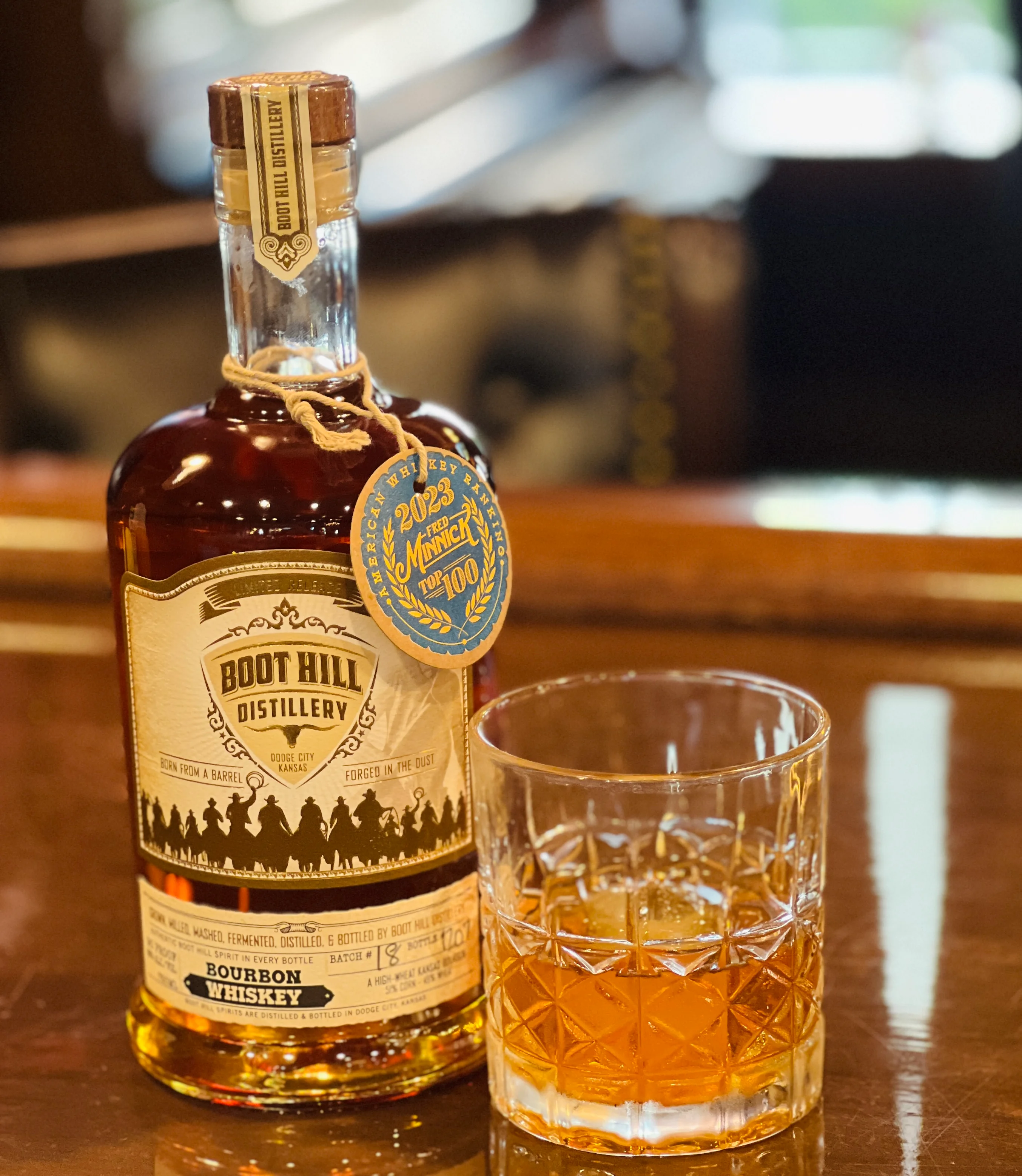 Bottle of Boot Hill Distillery bourbon whiskey with a glass