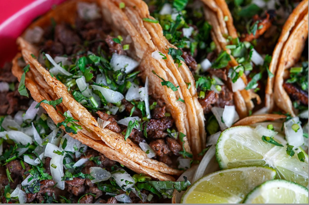 Authentic Mexican tacos al pastor with fresh toppings
