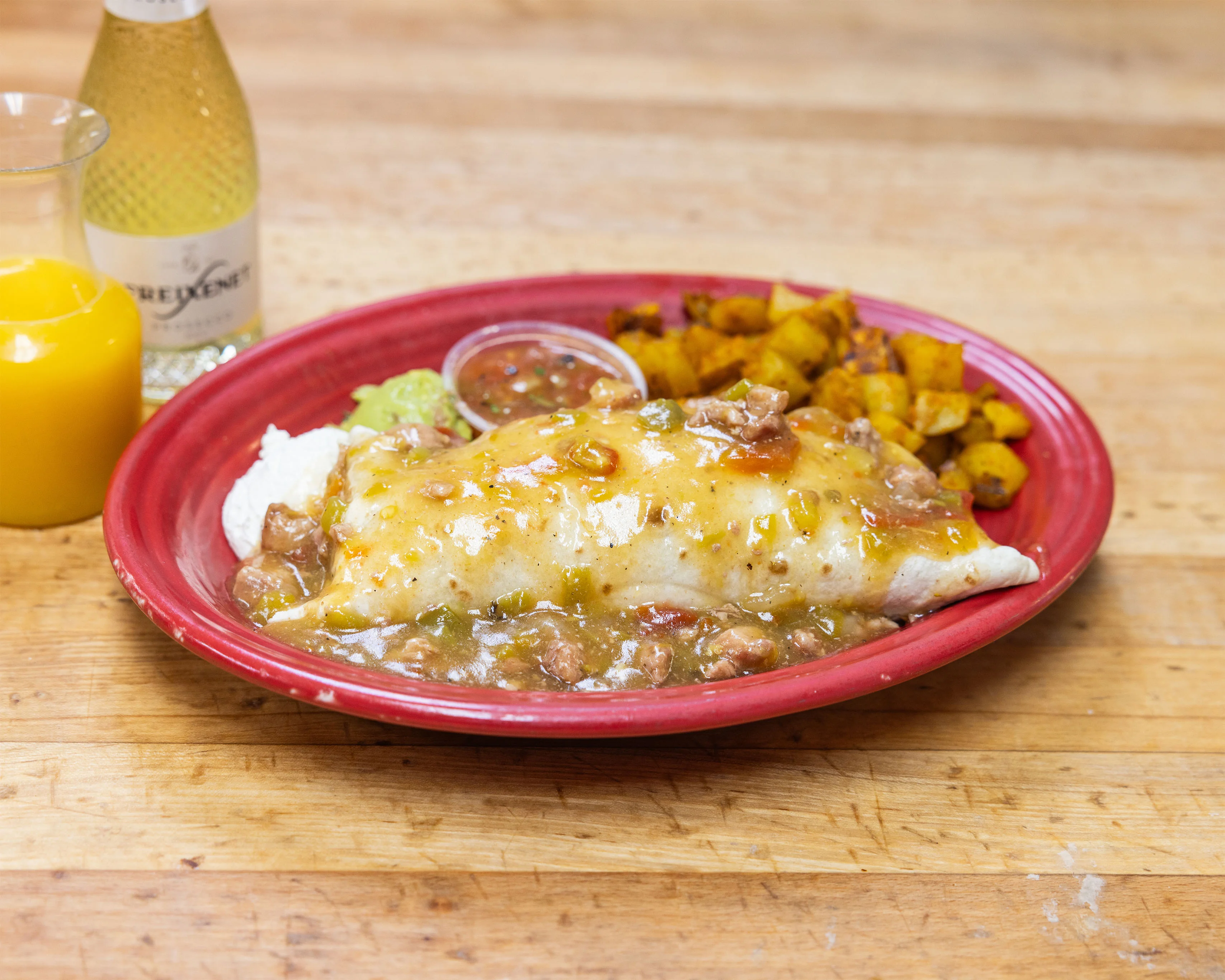 New Mexican enchiladas with green chile sauce and rice