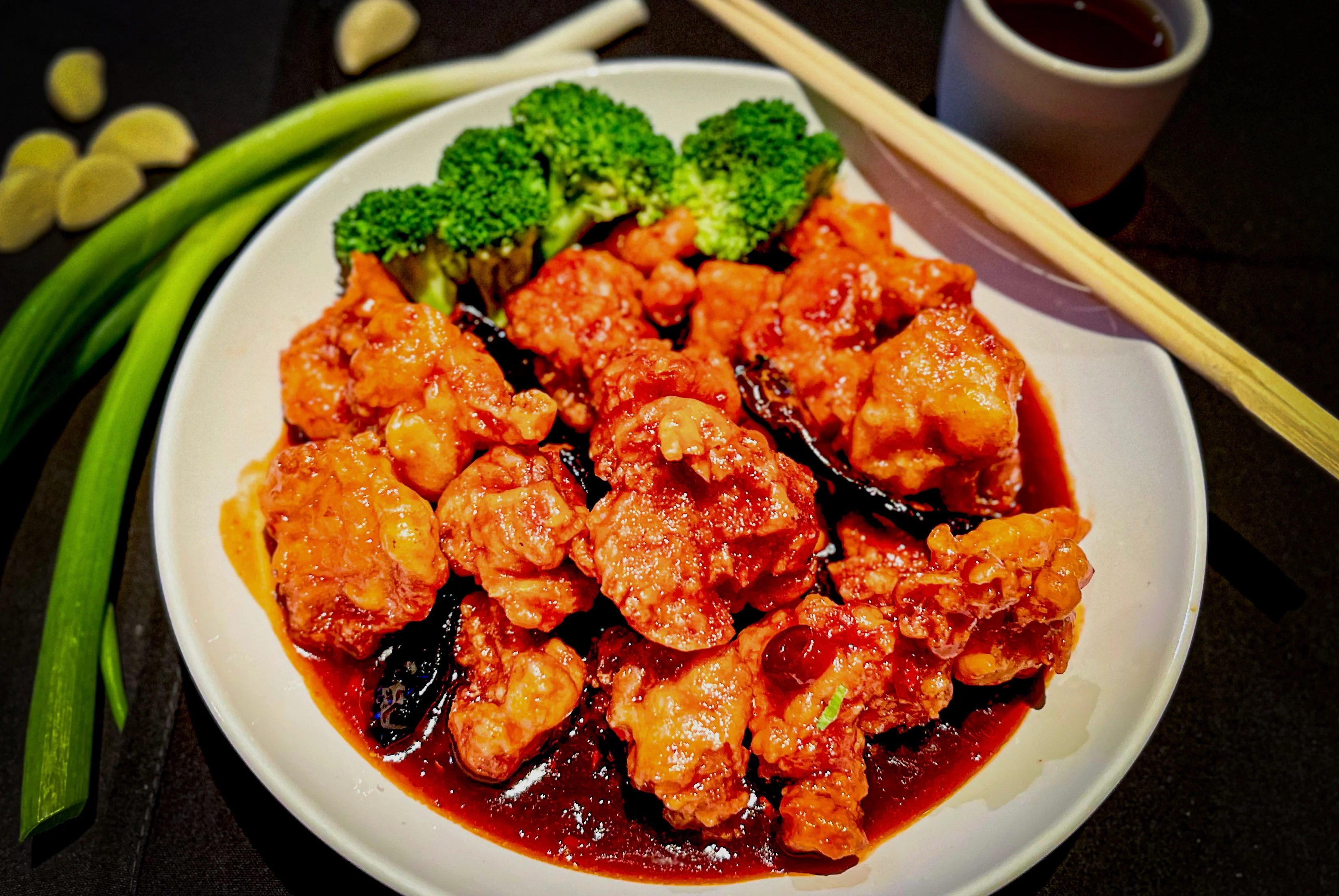 Sweet and sour chicken with broccoli in a Chinese restaurant