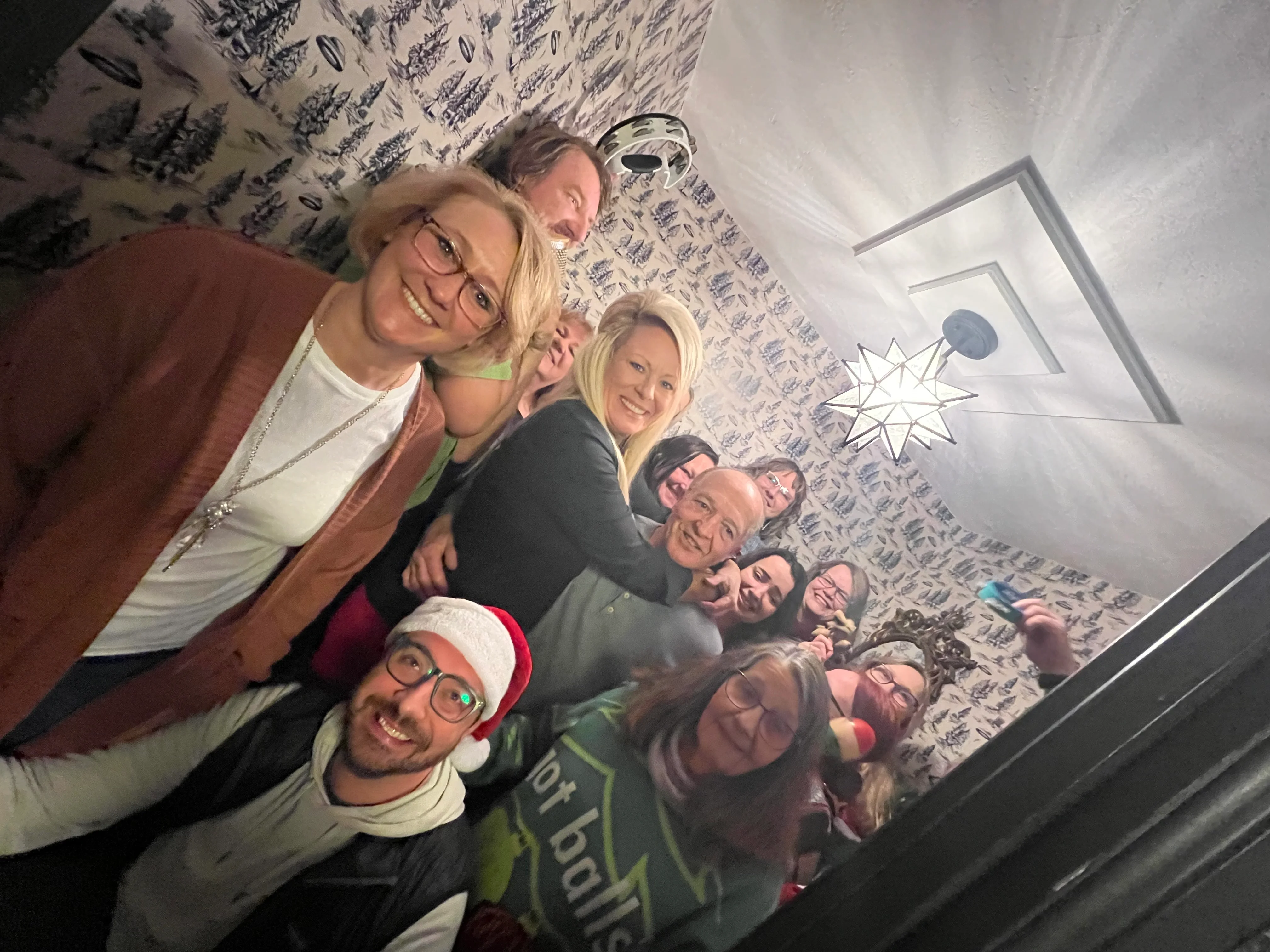 Group of friends celebrating in a cozy, festive setting