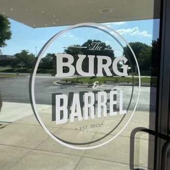 Restaurant entrance sign for The Burg & Barrel