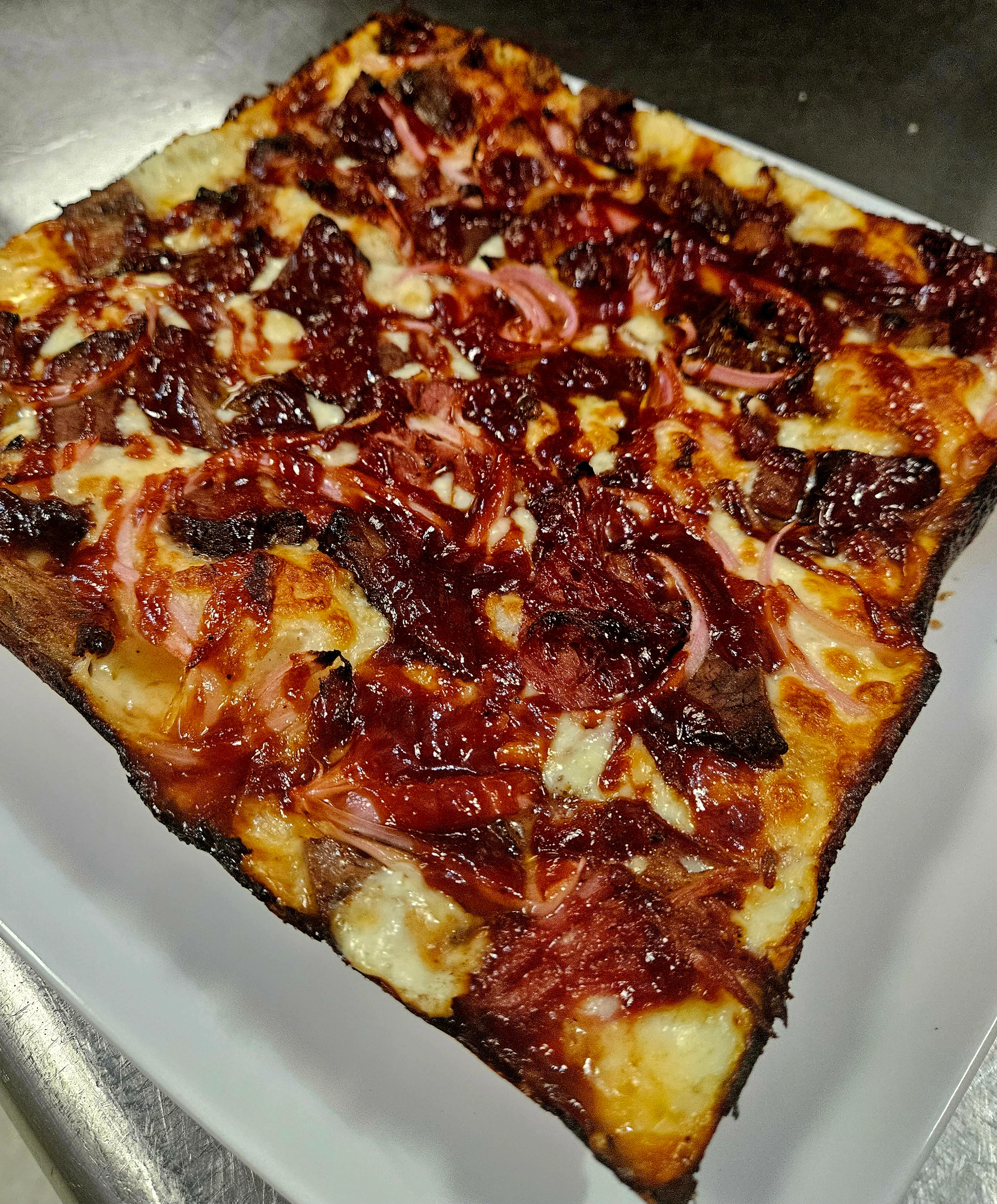 BBQ brisket pizza with caramelized onions