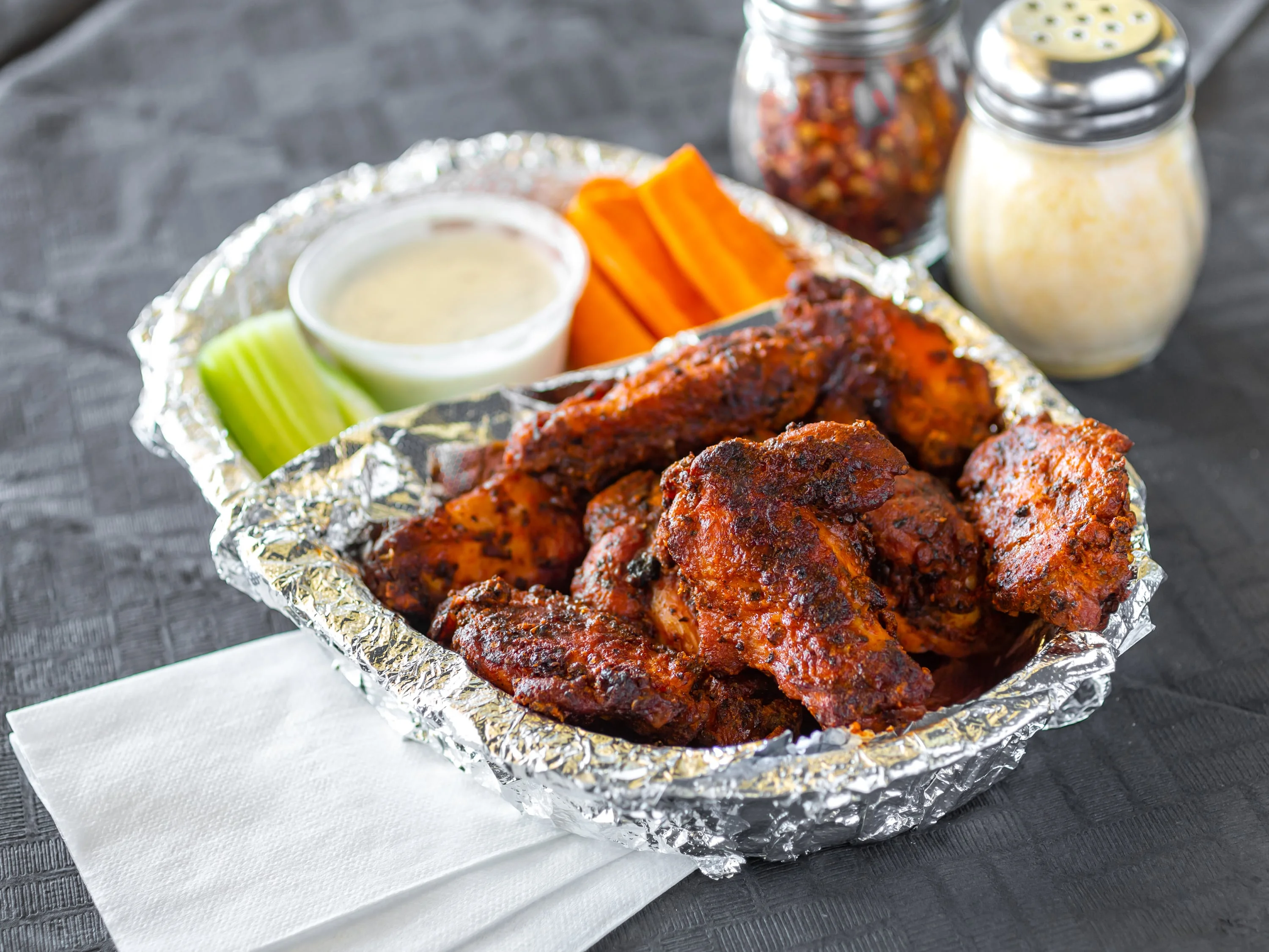Spicy buffalo chicken wings with celery and carrots