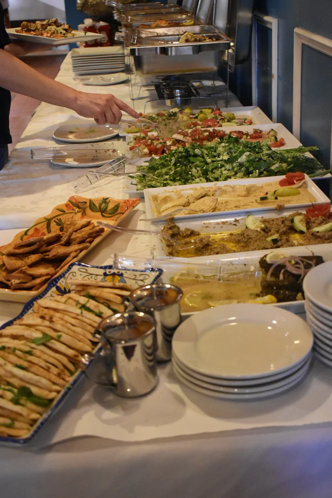 Mixed grill platter featuring Mediterranean kebabs and grilled vegetables