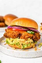 Crispy fried chicken sandwich with lettuce and pickles