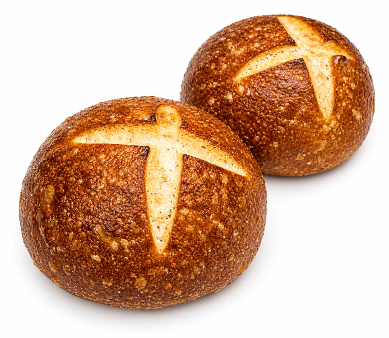 Two round artisan bread rolls with a cross pattern on top.