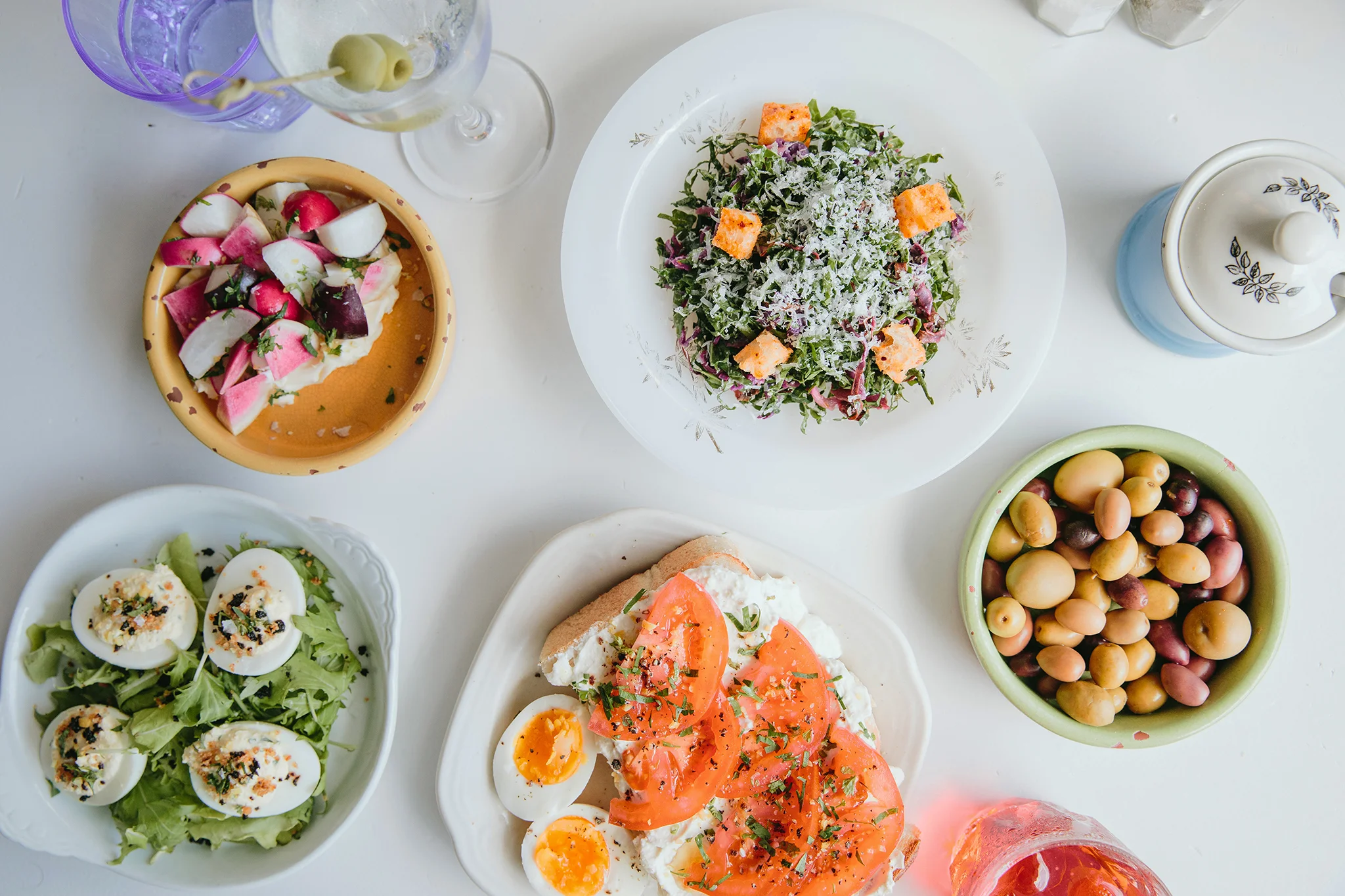 Mediterranean mezze platter with fresh salads and olives