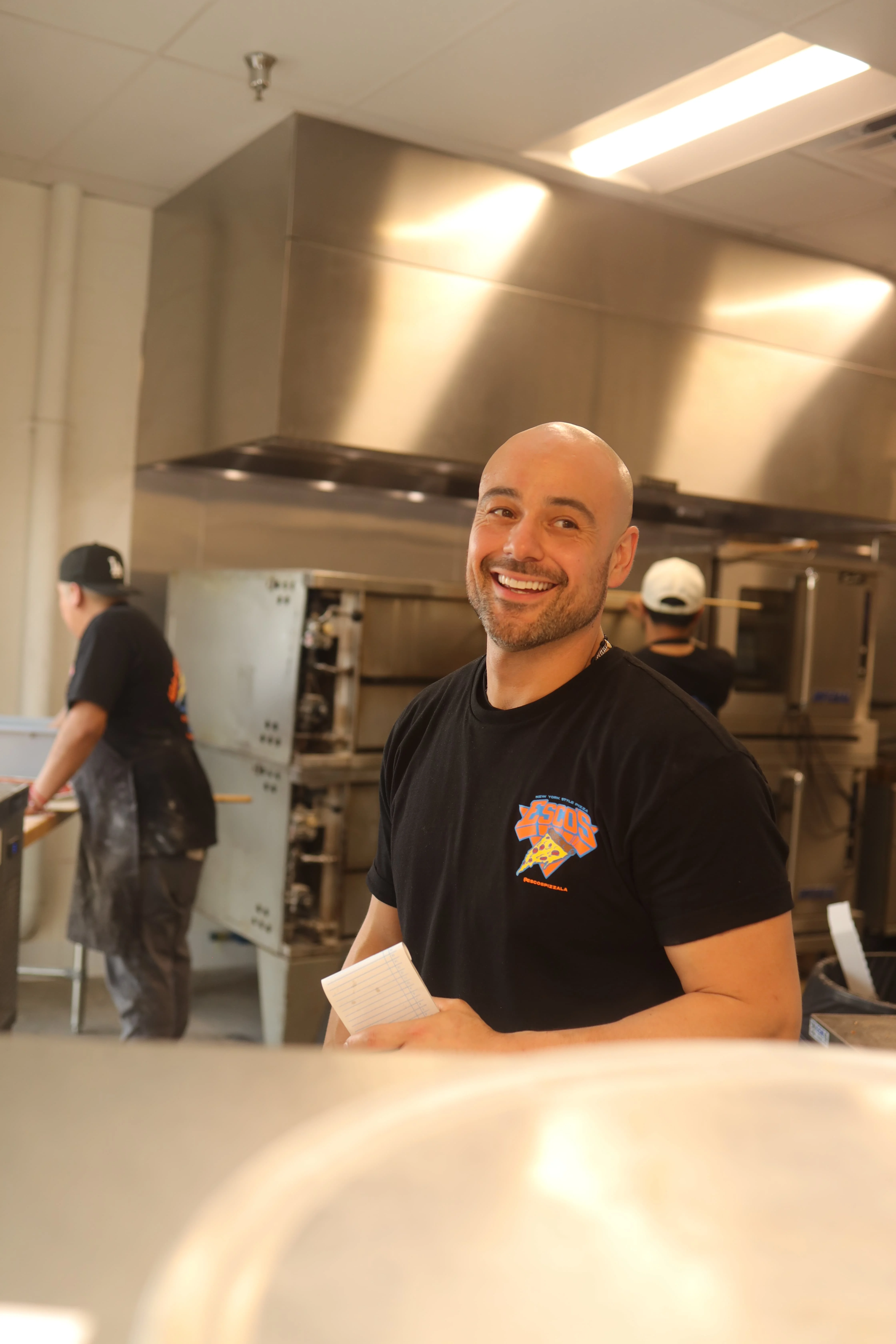 Smiling chef in a kitchen preparing food