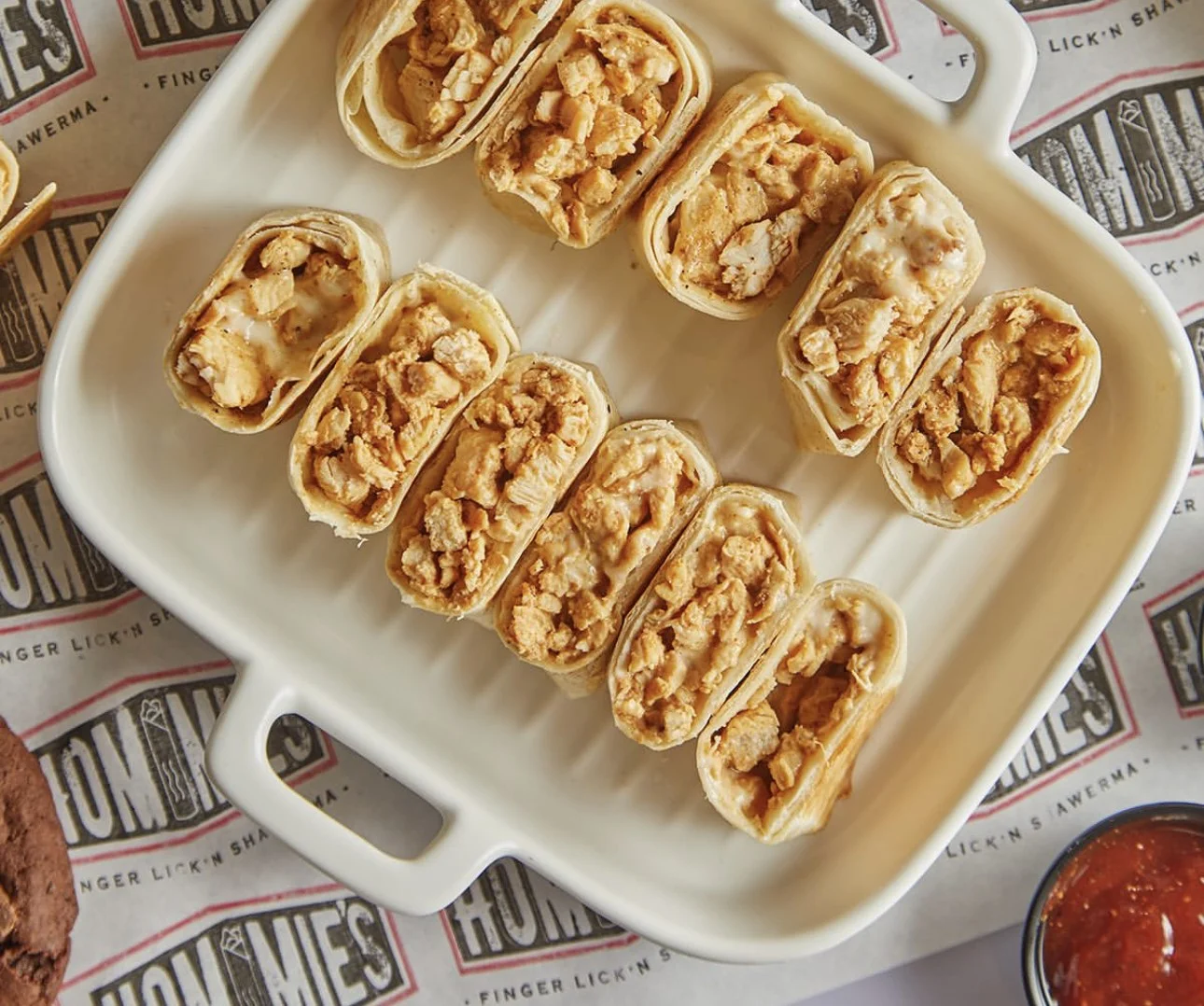 Crispy chicken taquitos served with salsa