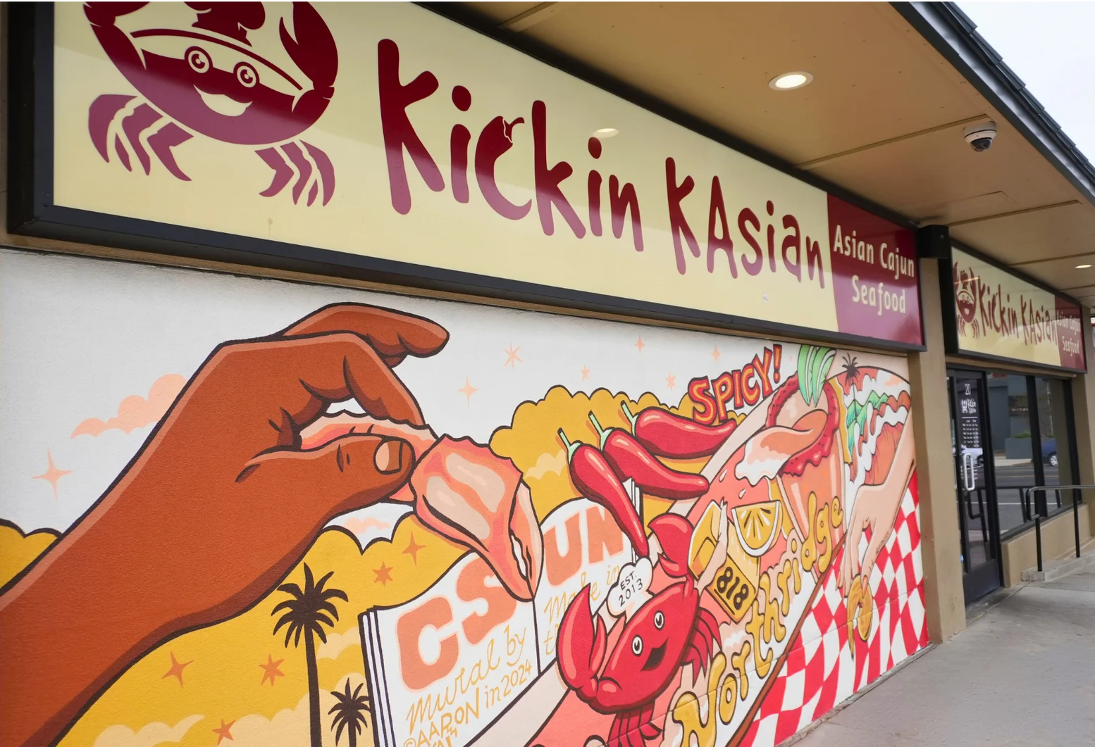 Colorful mural of Asian Cajun seafood restaurant exterior