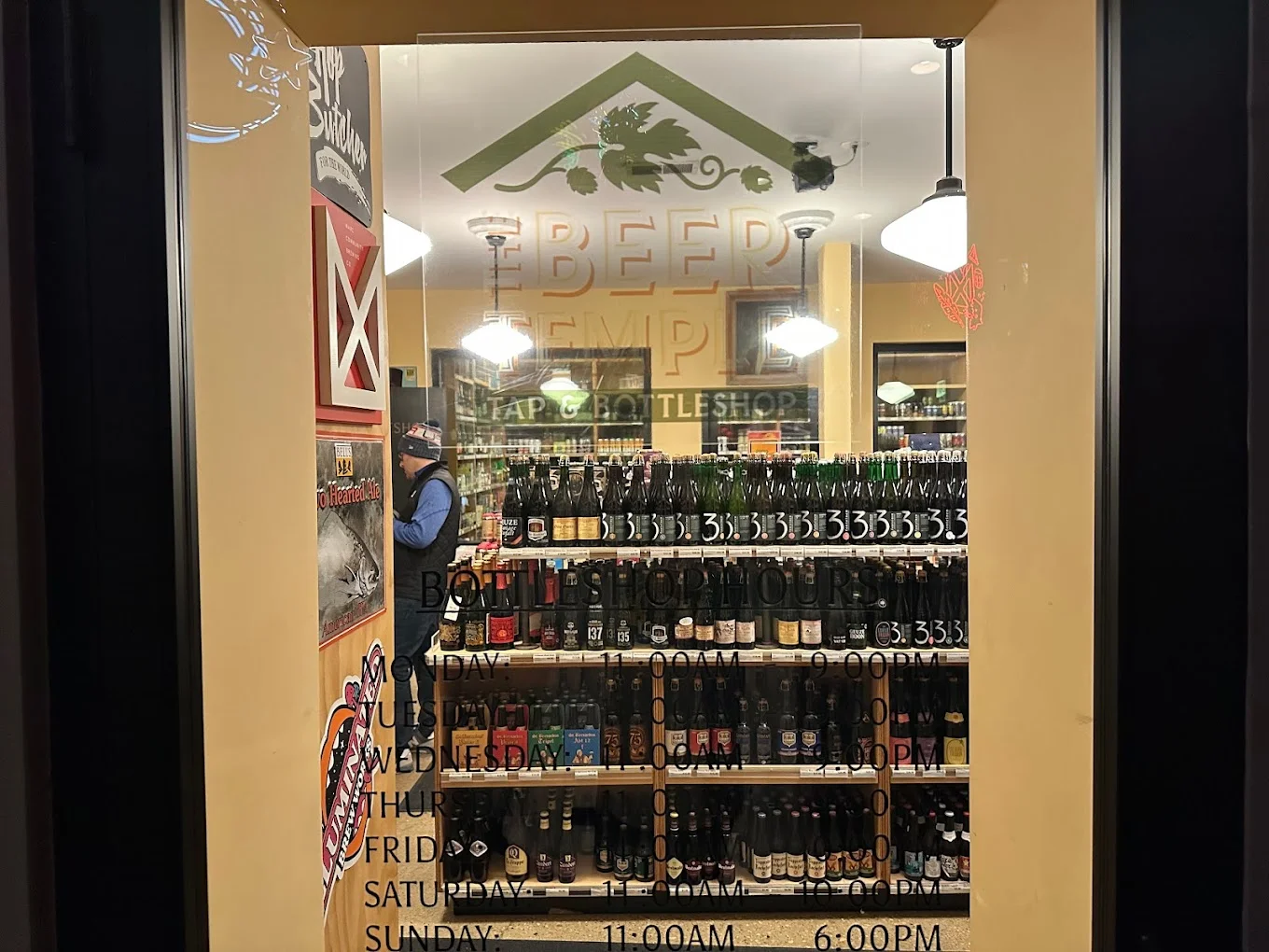 View of a craft beer shop showcasing various bottled beers
