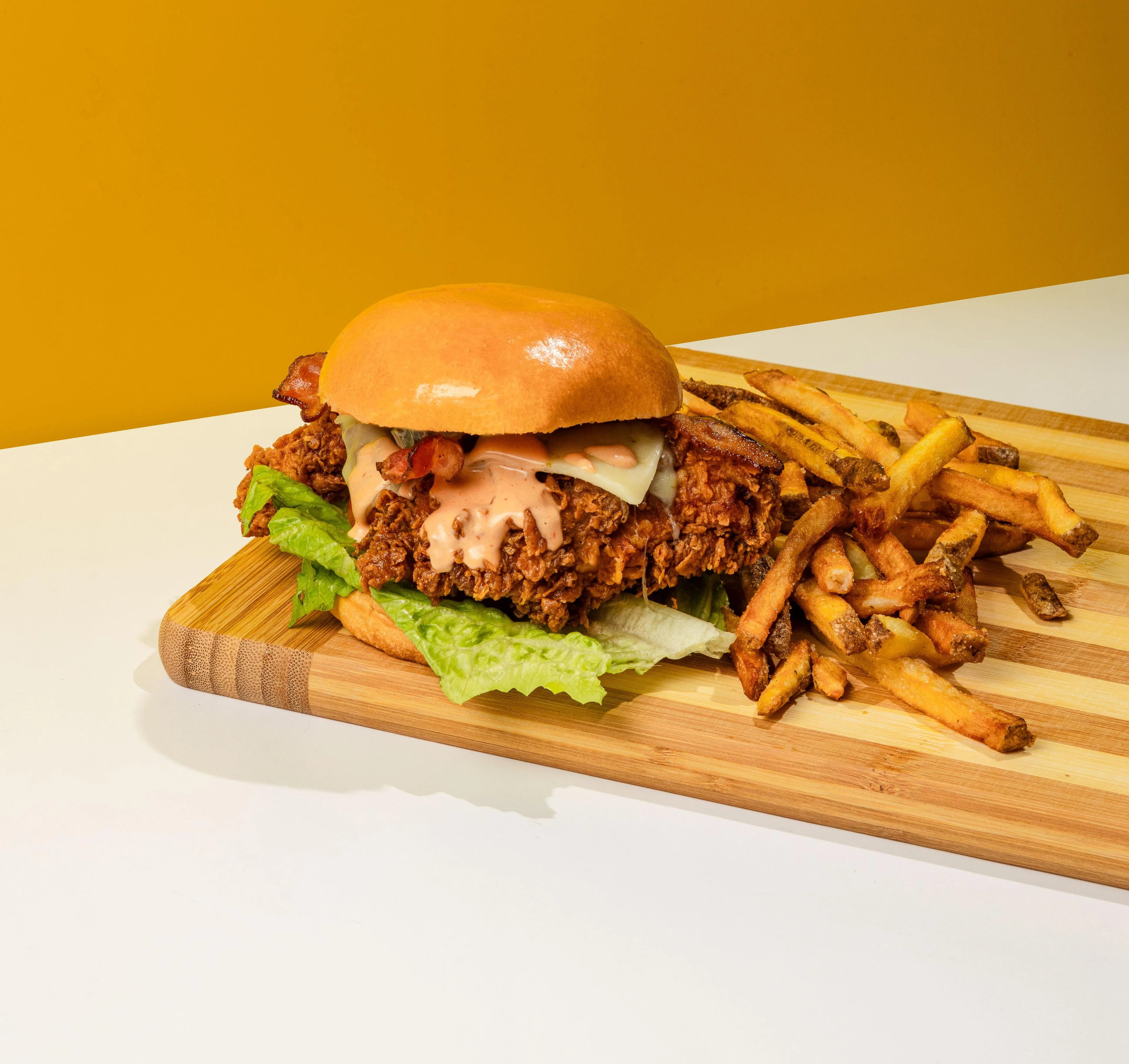 Crispy fried chicken sandwich with fries