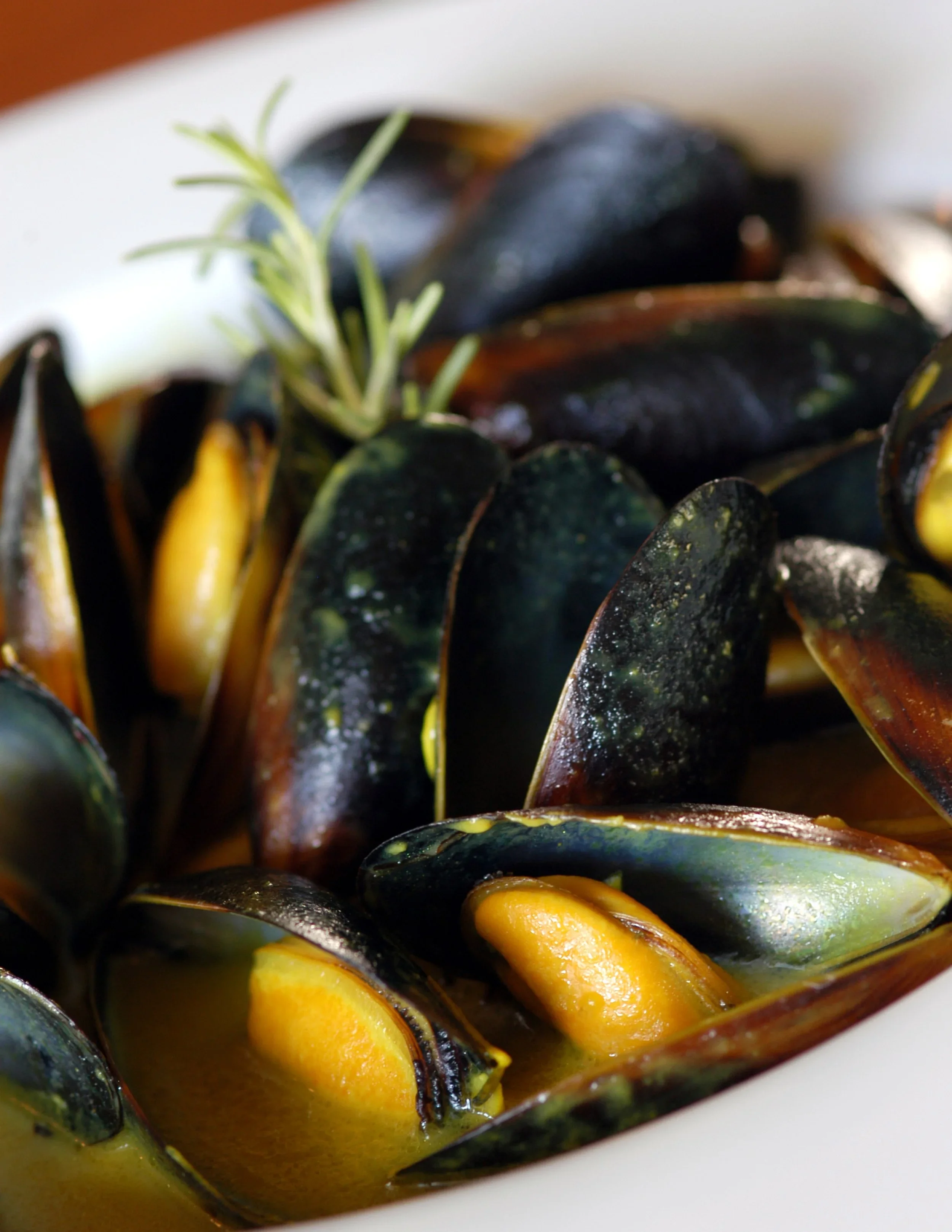Delicious bowl of French moules marinières with herbs