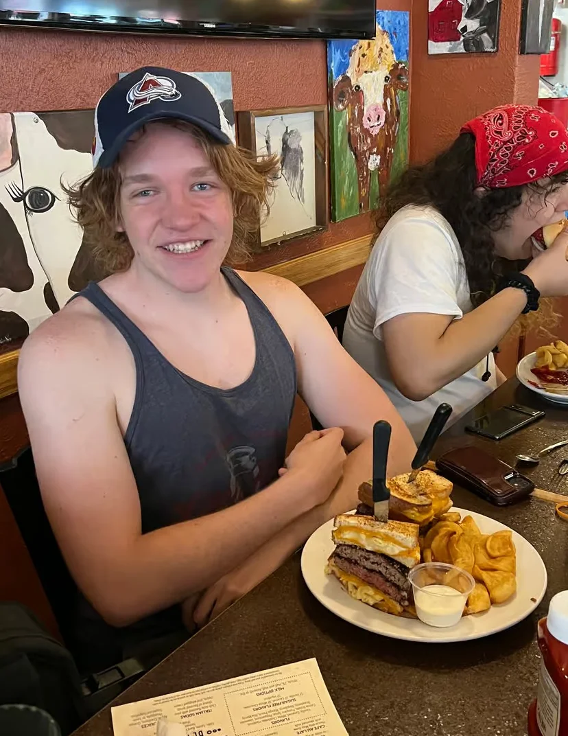Hearty American cheeseburger with fries in a cozy diner setting