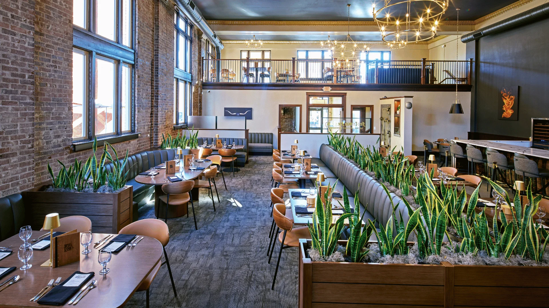Stylish restaurant interior with modern decor and greenery