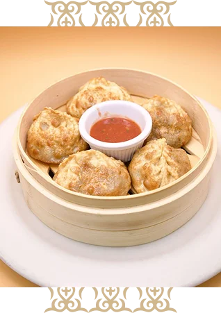 Delicious Nepali momo dumplings with dipping sauce
