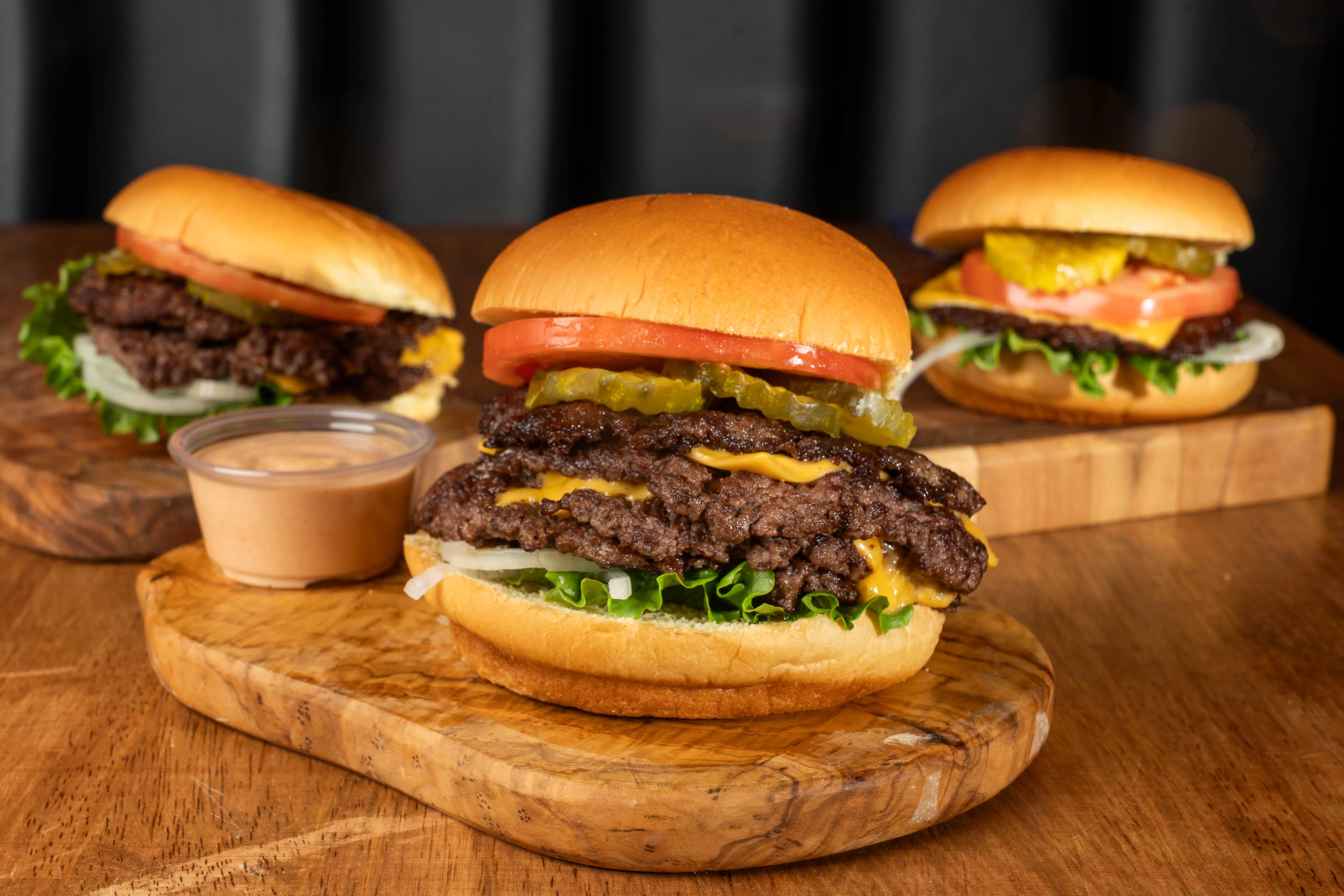 Classic American cheeseburgers with fresh toppings