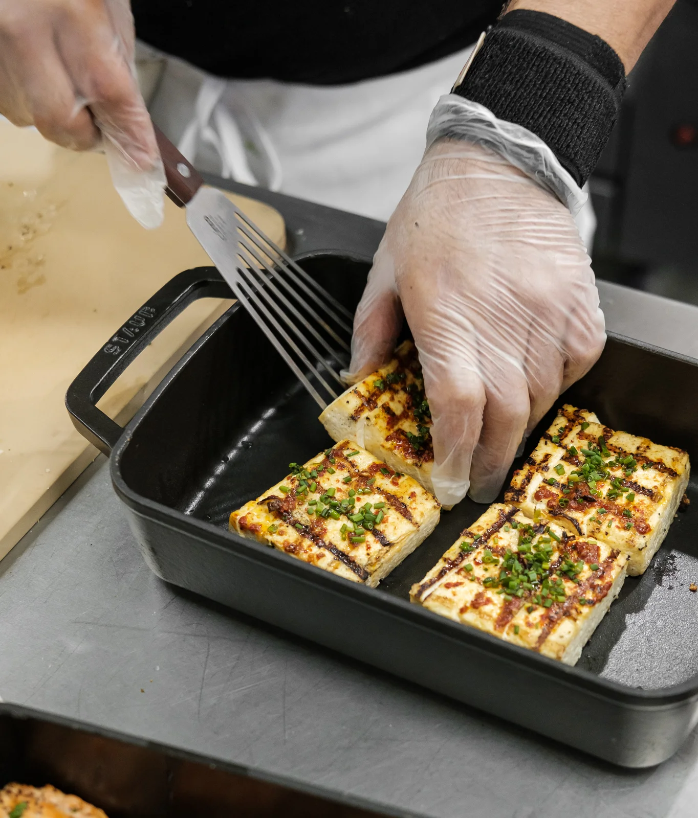 Grilled tofu slices garnished with herbs