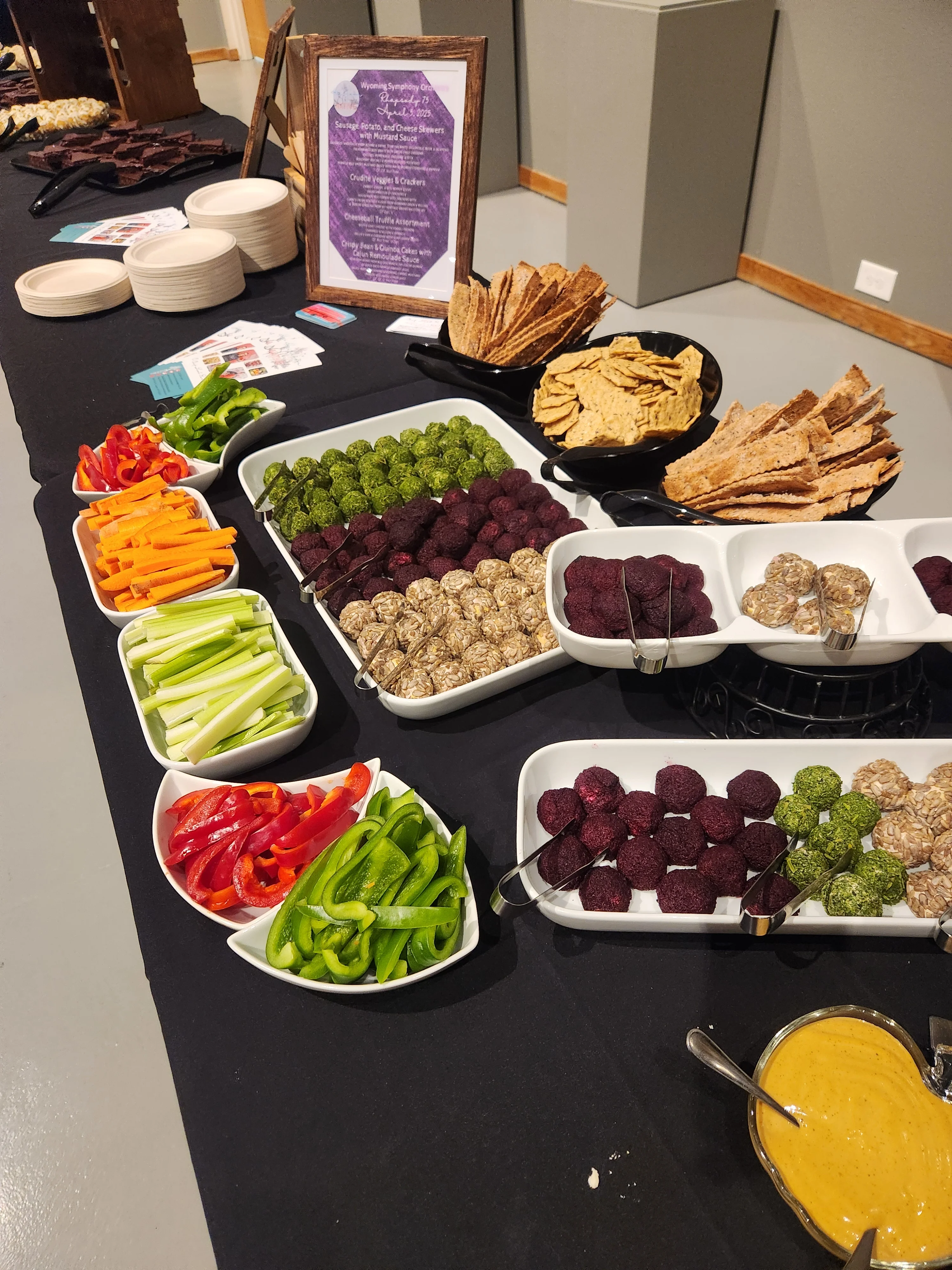 Colorful vegetable platter with healthy snacks and dips